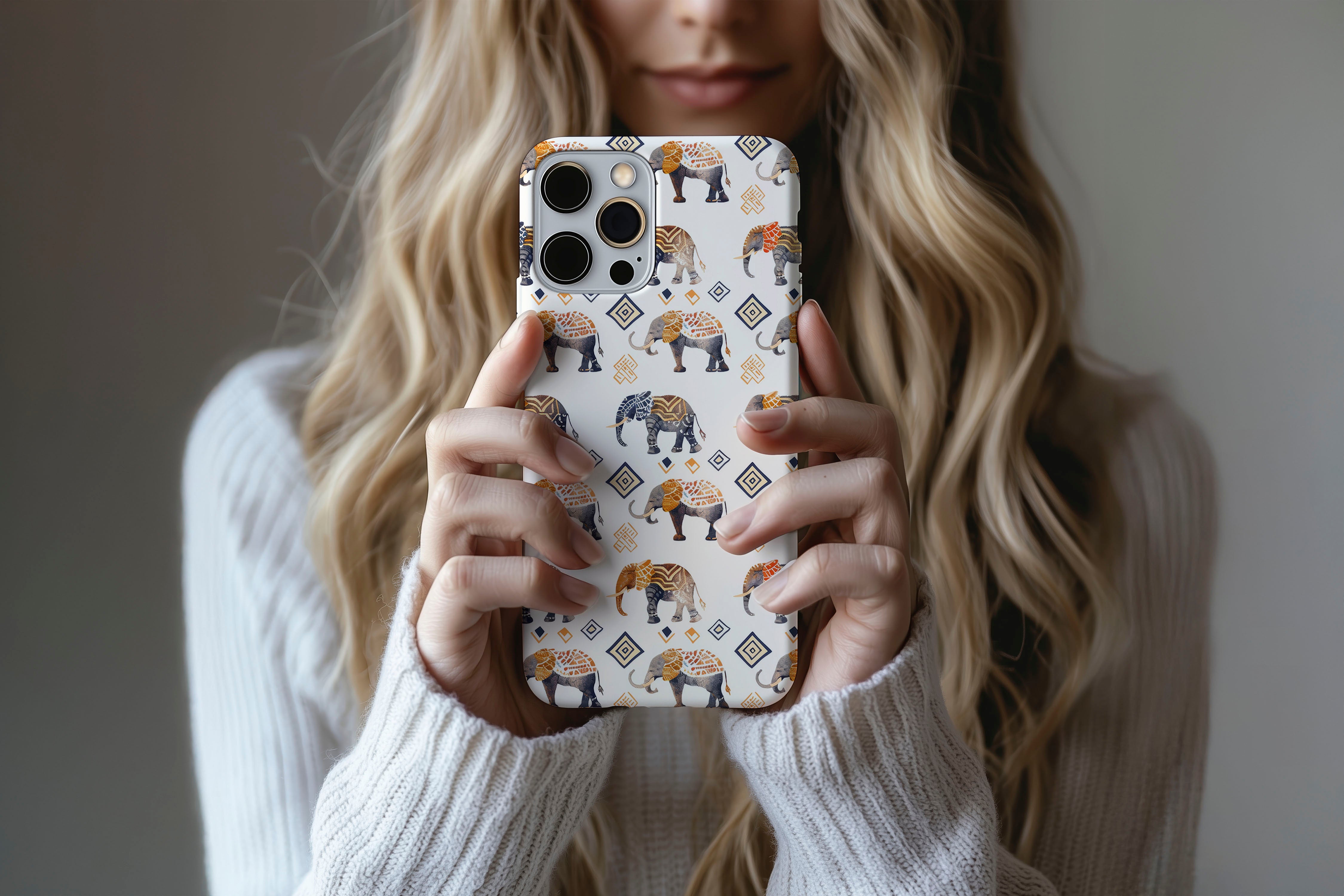 A cute girl holding a phone case featuring our Elephants design