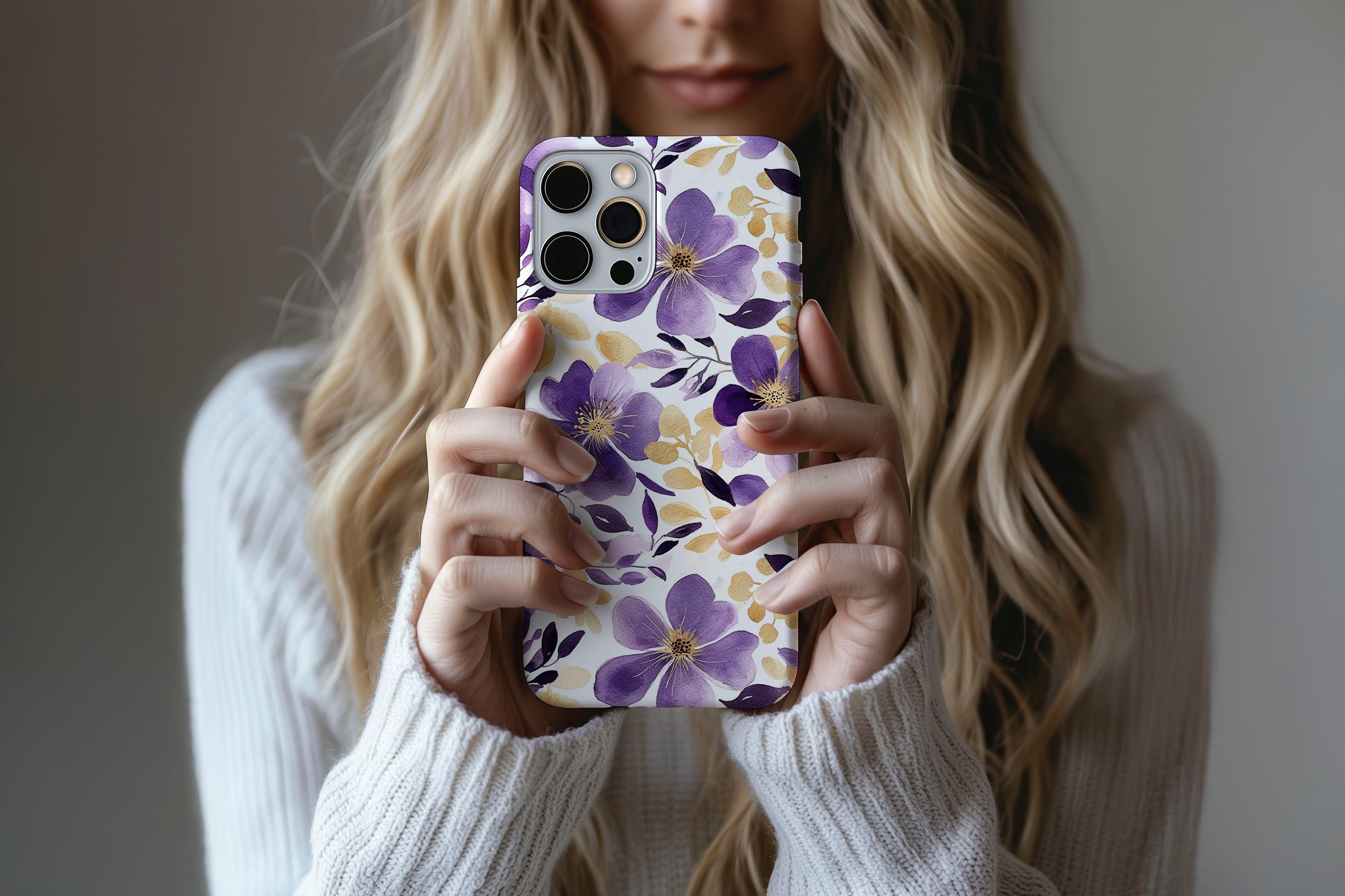 A cute girl holding a phone case featuring our Parma Violets design