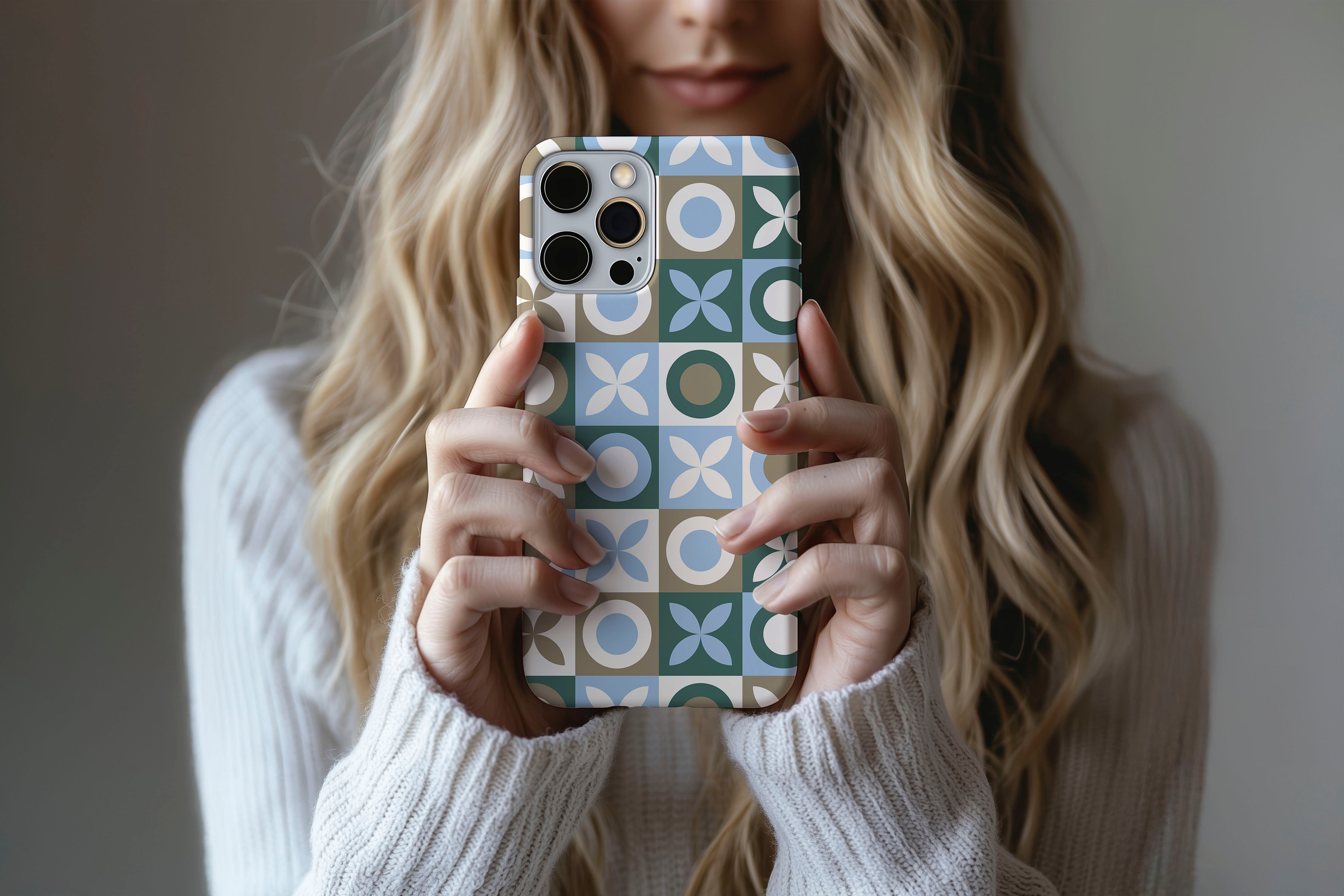A cute girl holding a phone case featuring our Tile design