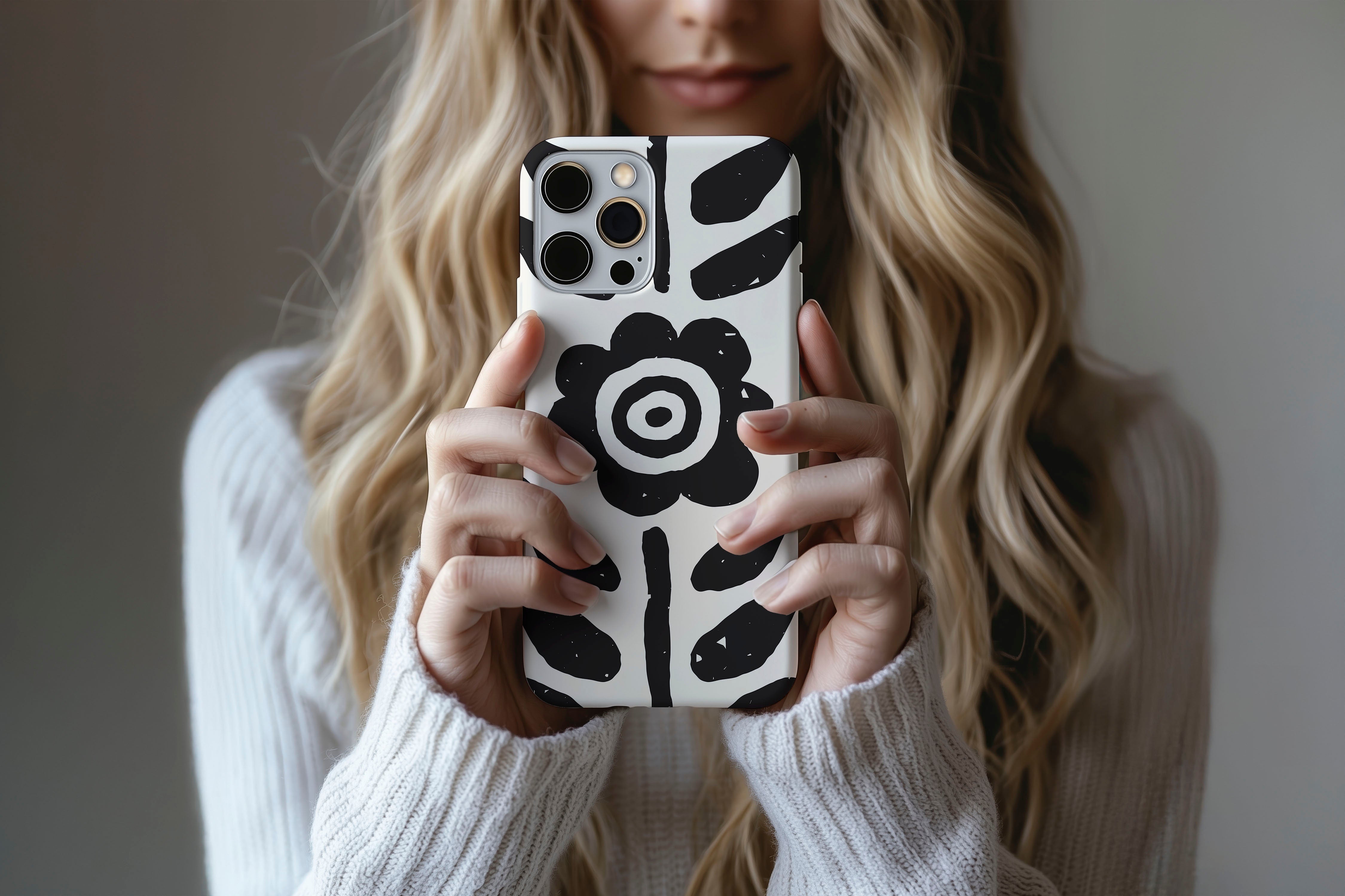 A cute girl holding a phone case featuring our Abstract Flower design