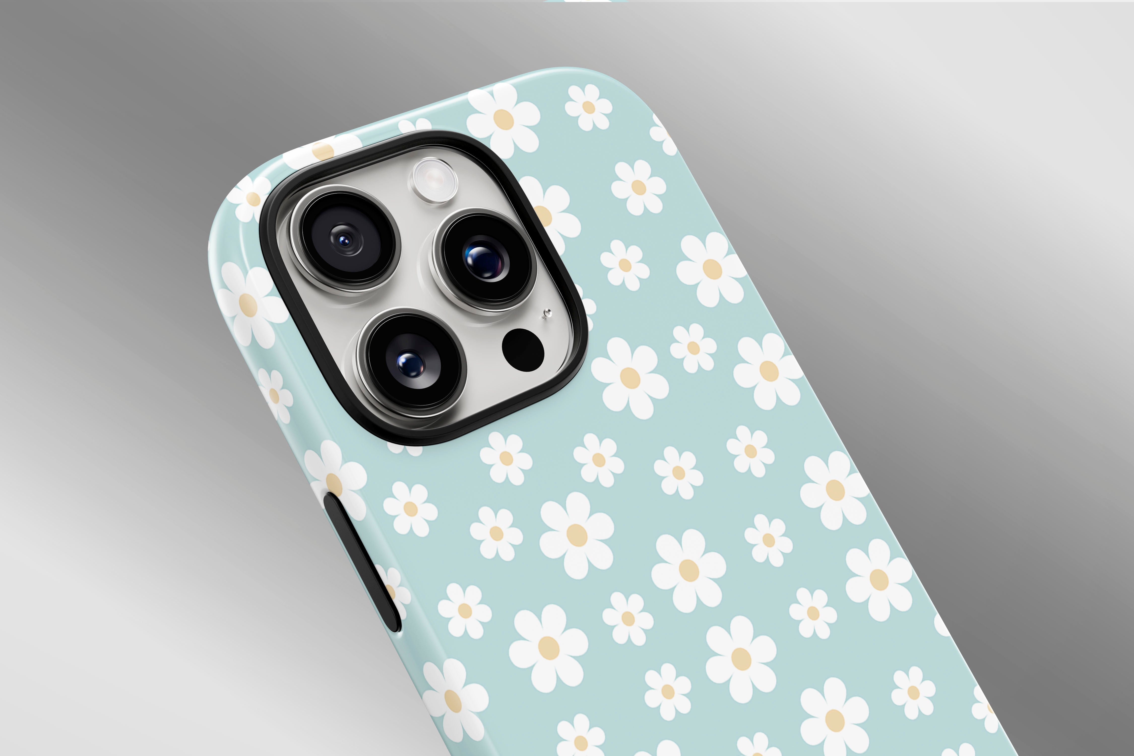 A close up image of a phone case featuring our Aqua Daisy design