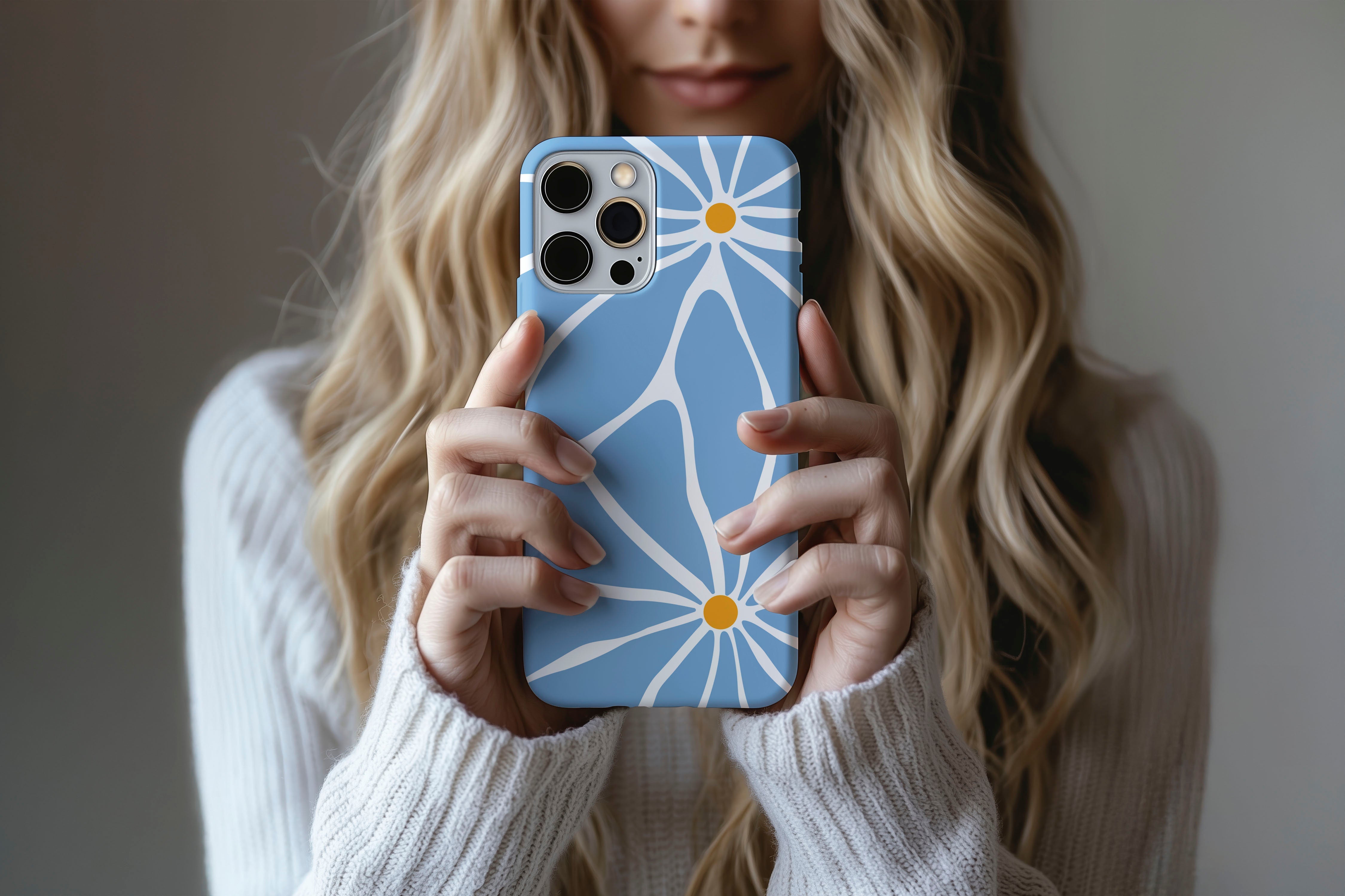A cute girl holding a phone case featuring our Big Flower design