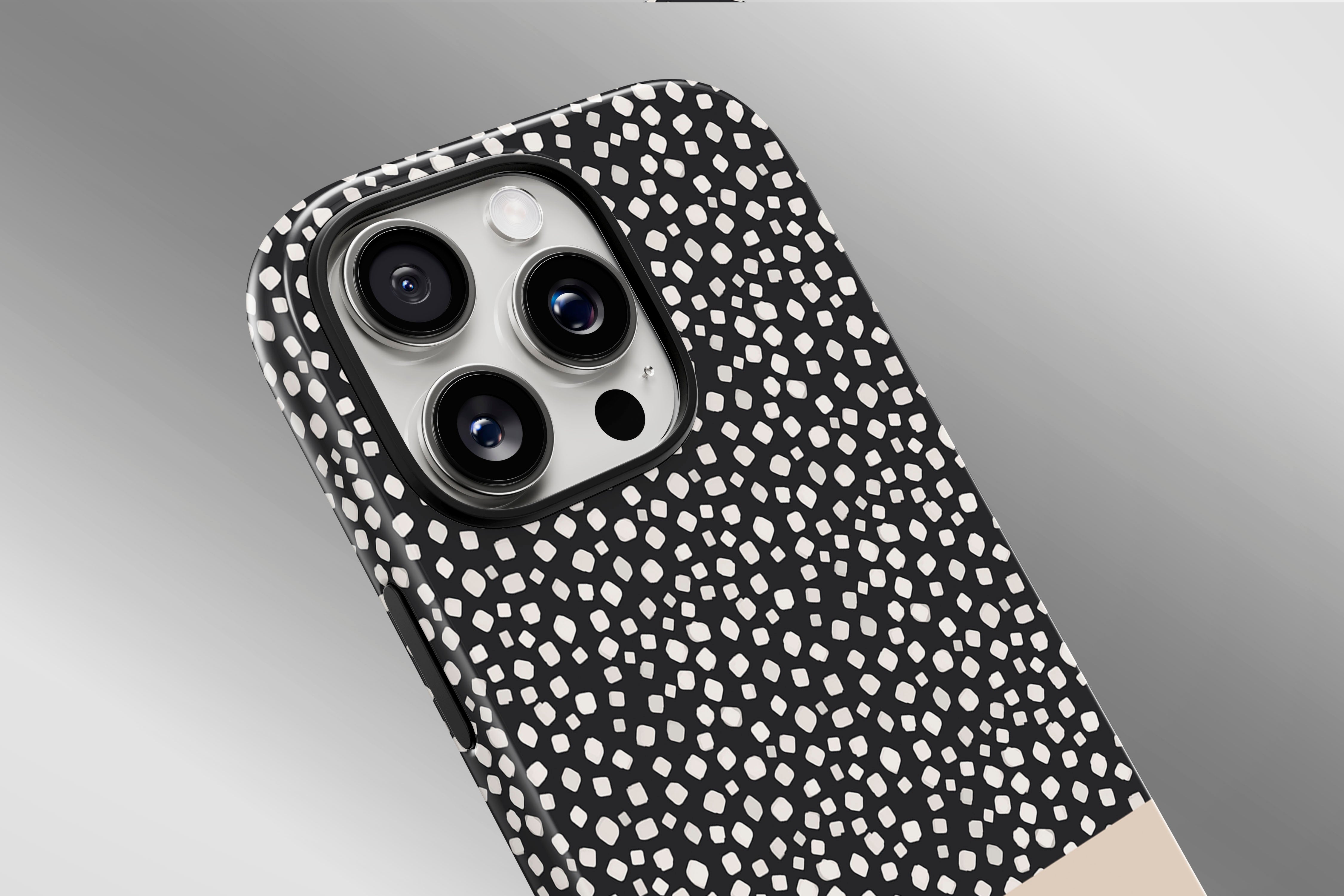 A close up image of a phone case featuring our Black Spots design