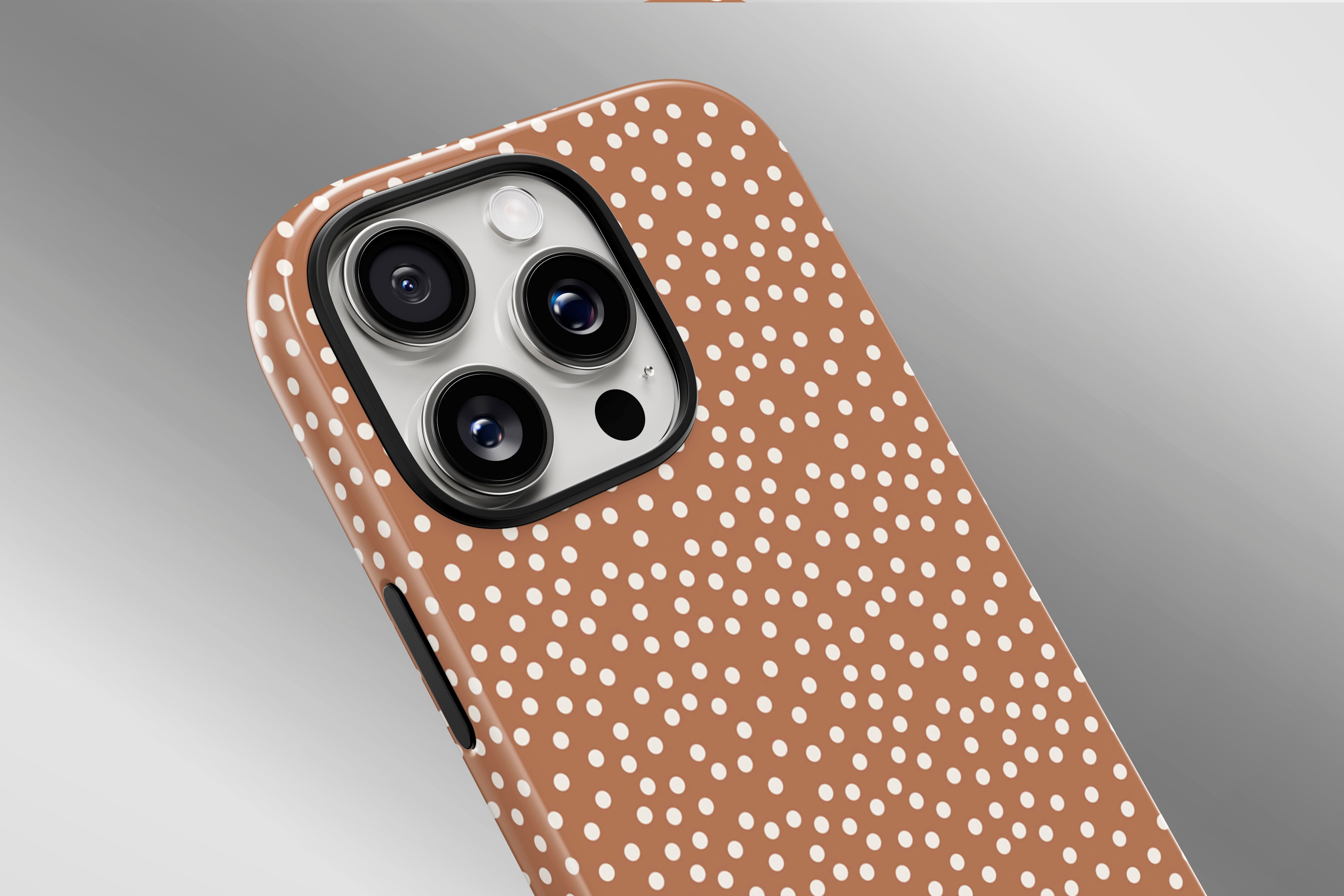 A close up image of a phone case featuring our Caramel Dot design