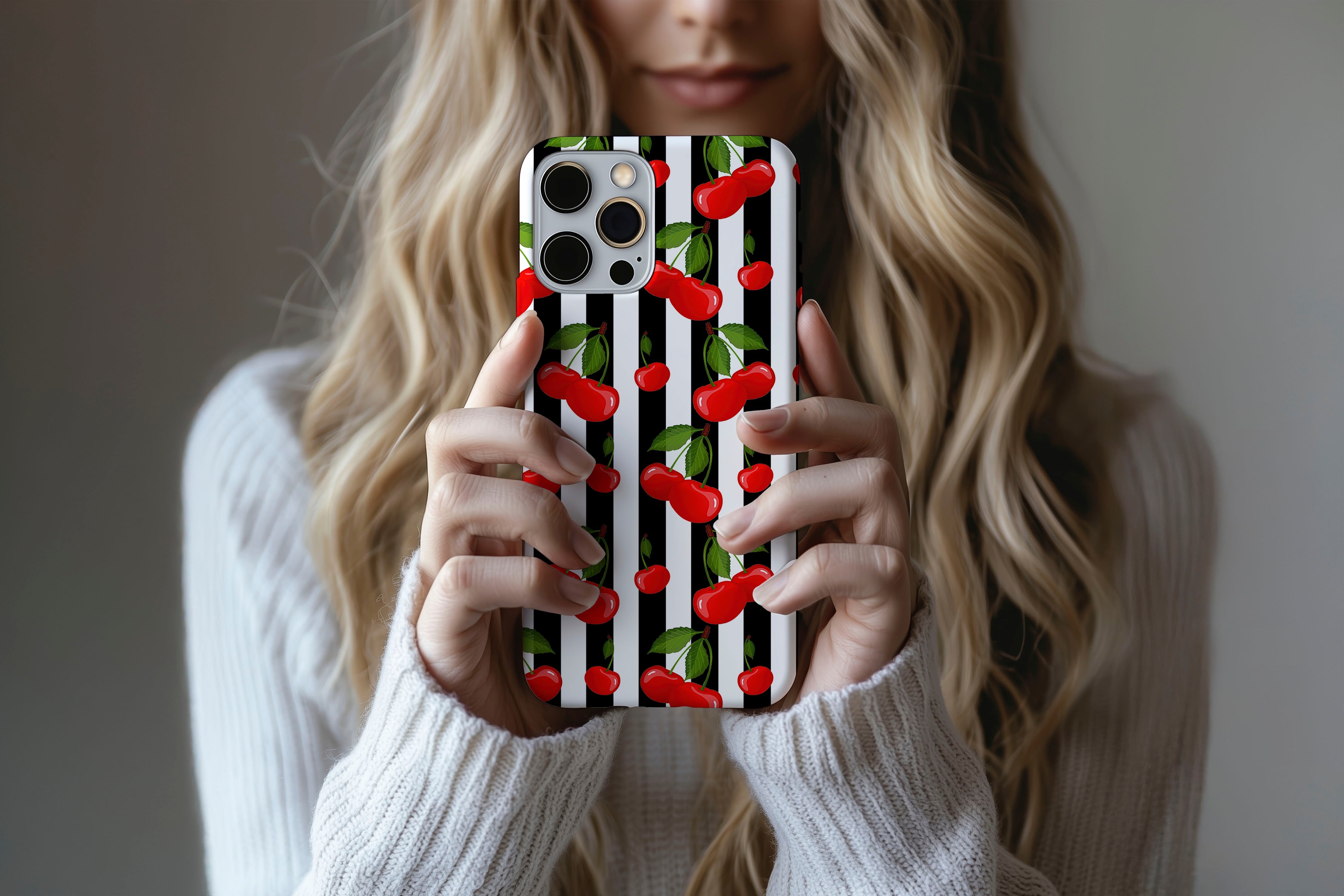 A cute girl holding a phone case featuring our Cherry Pop design