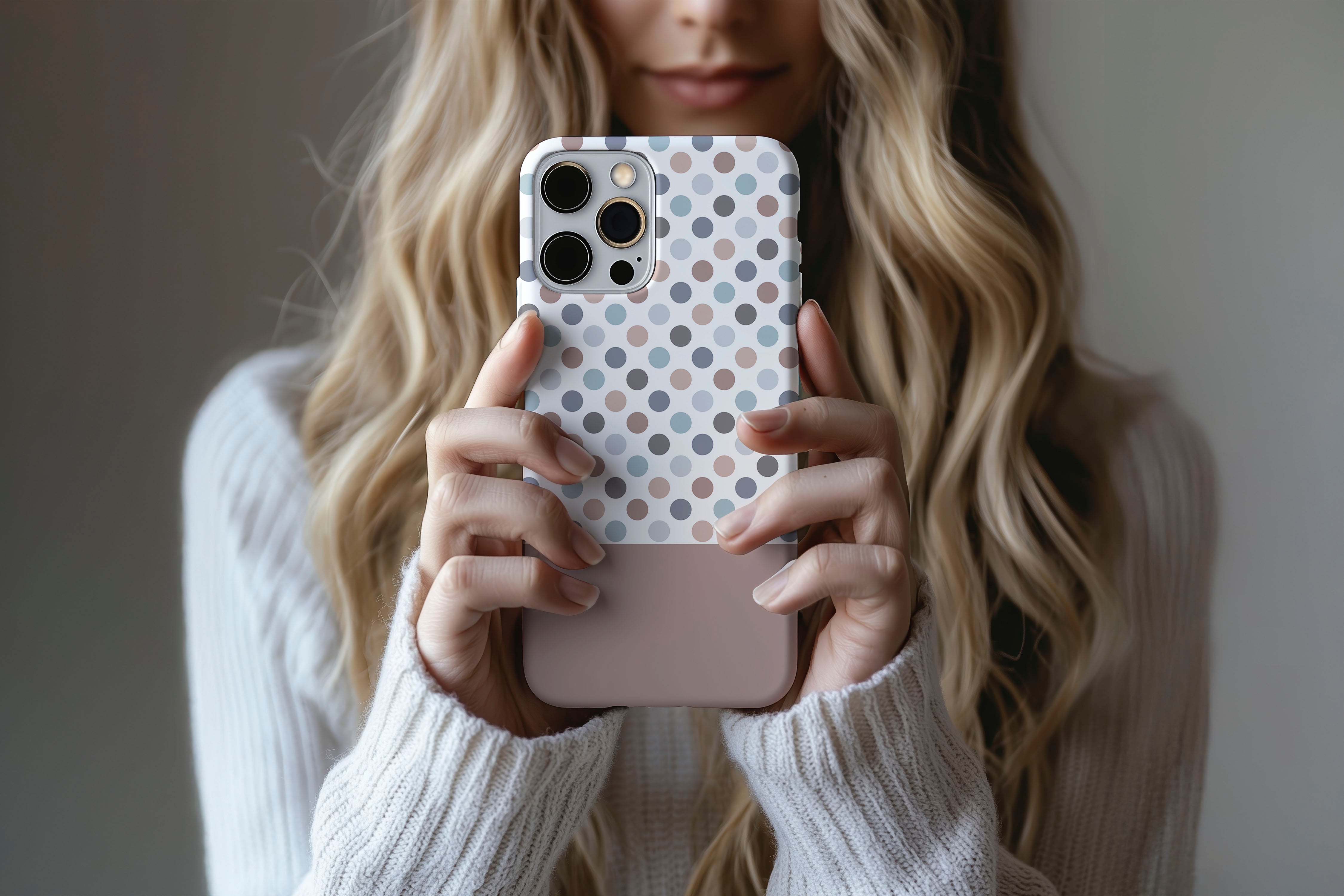 A cute girl holding a phone case featuring our Chocco Spotty design