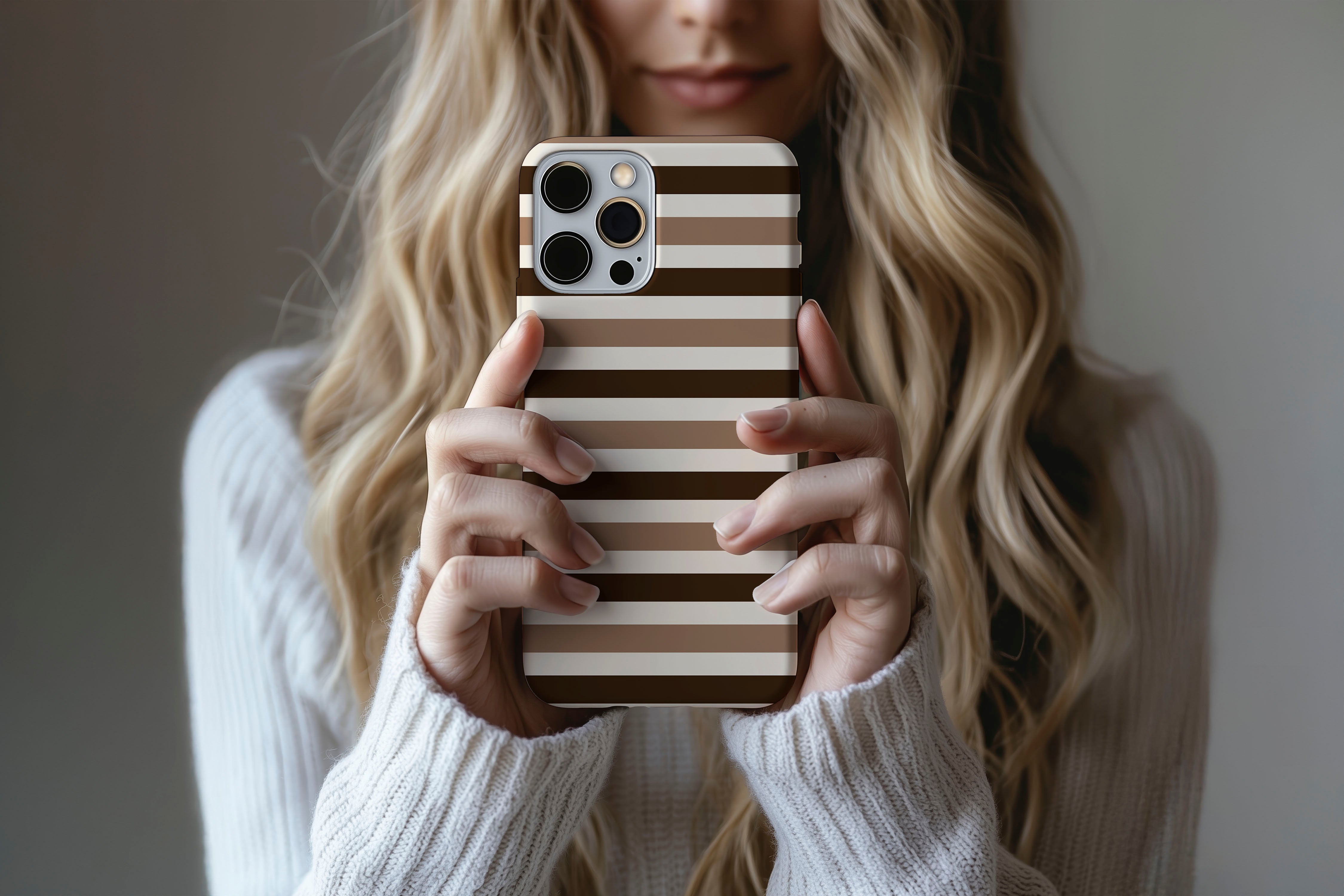 A cute girl holding a phone case featuring our Chocolate Ice Cream design