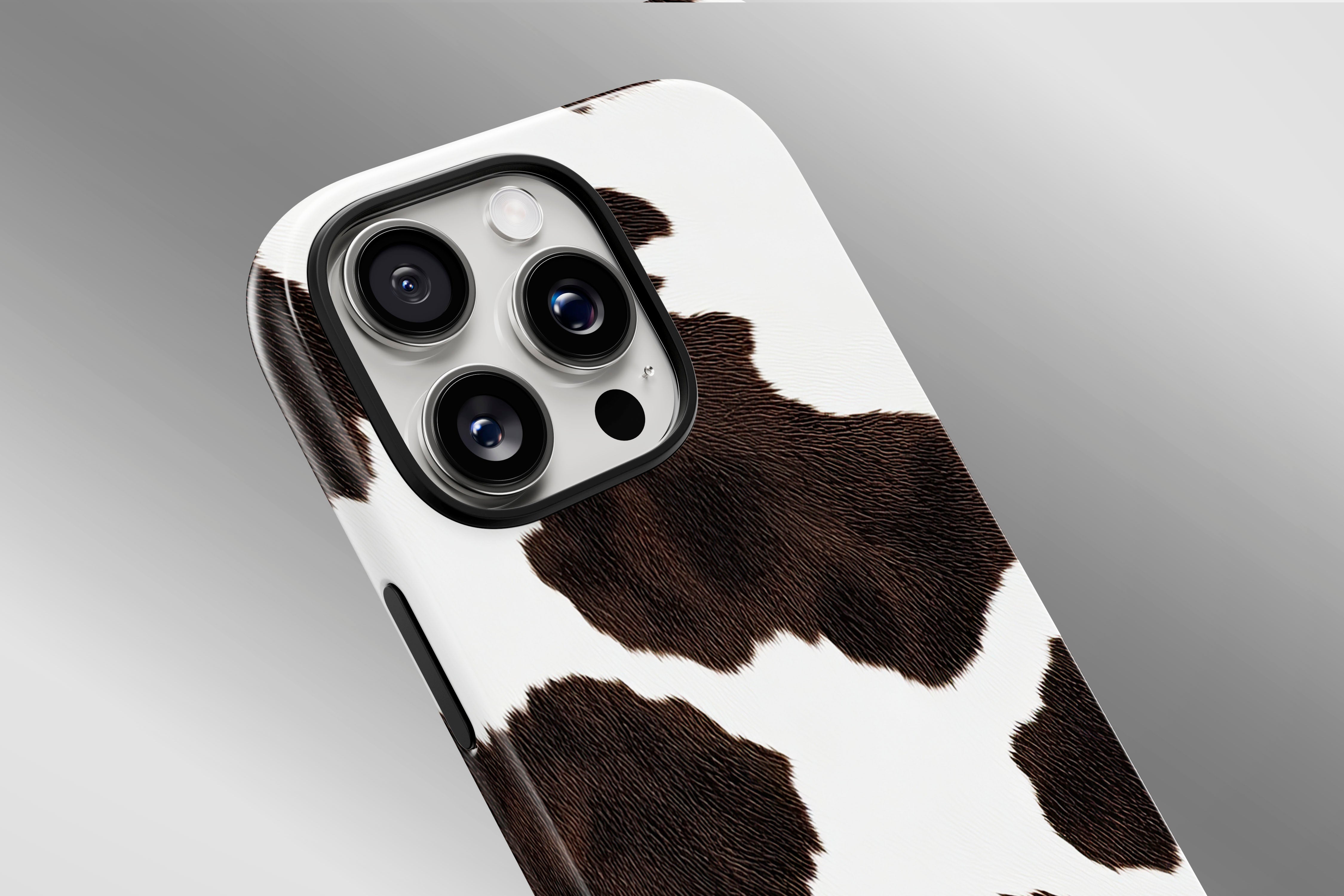 A close up image of a phone case featuring our Cow Hide design