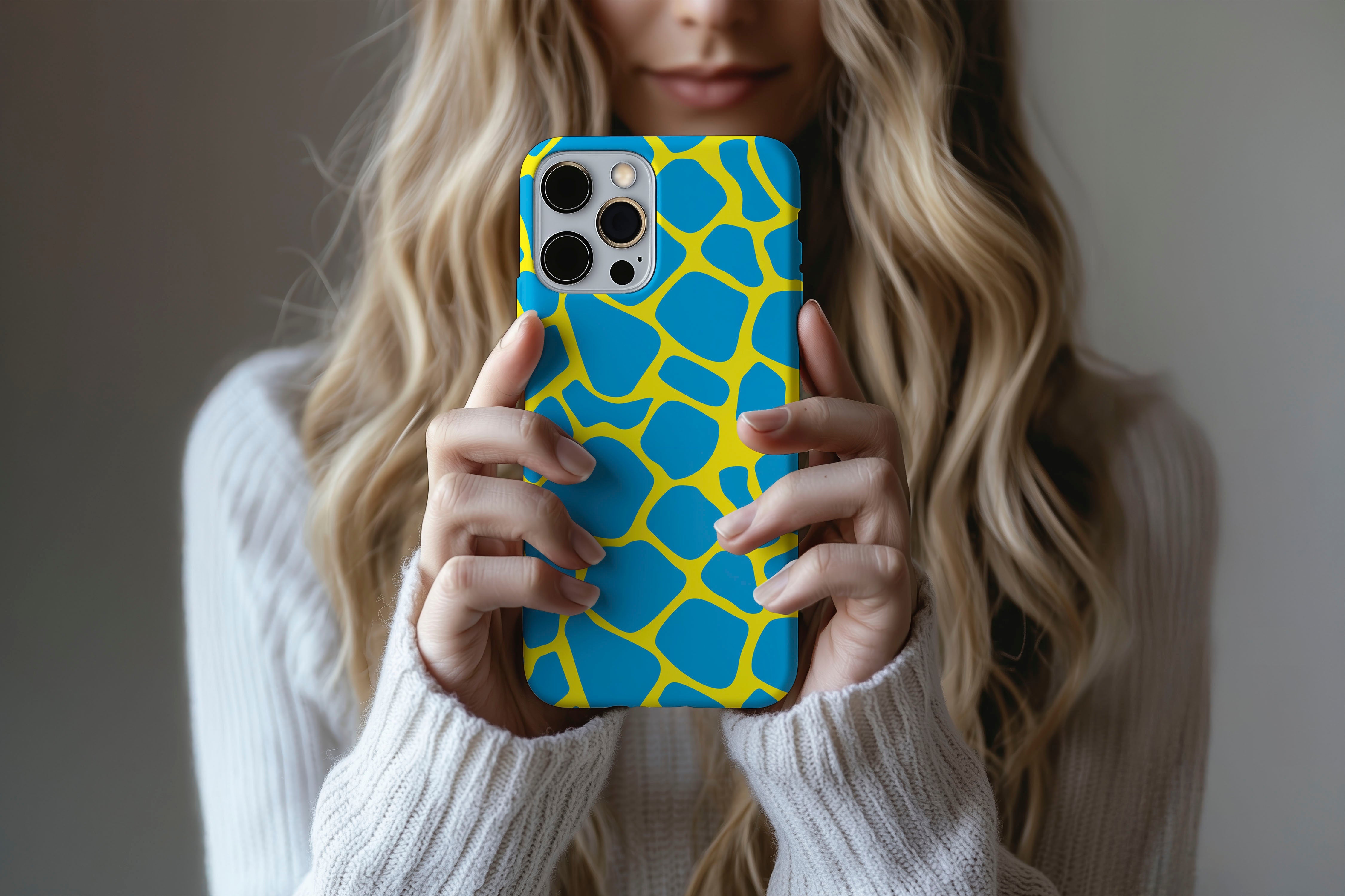 A cute girl holding a phone case featuring our Cow Lick design