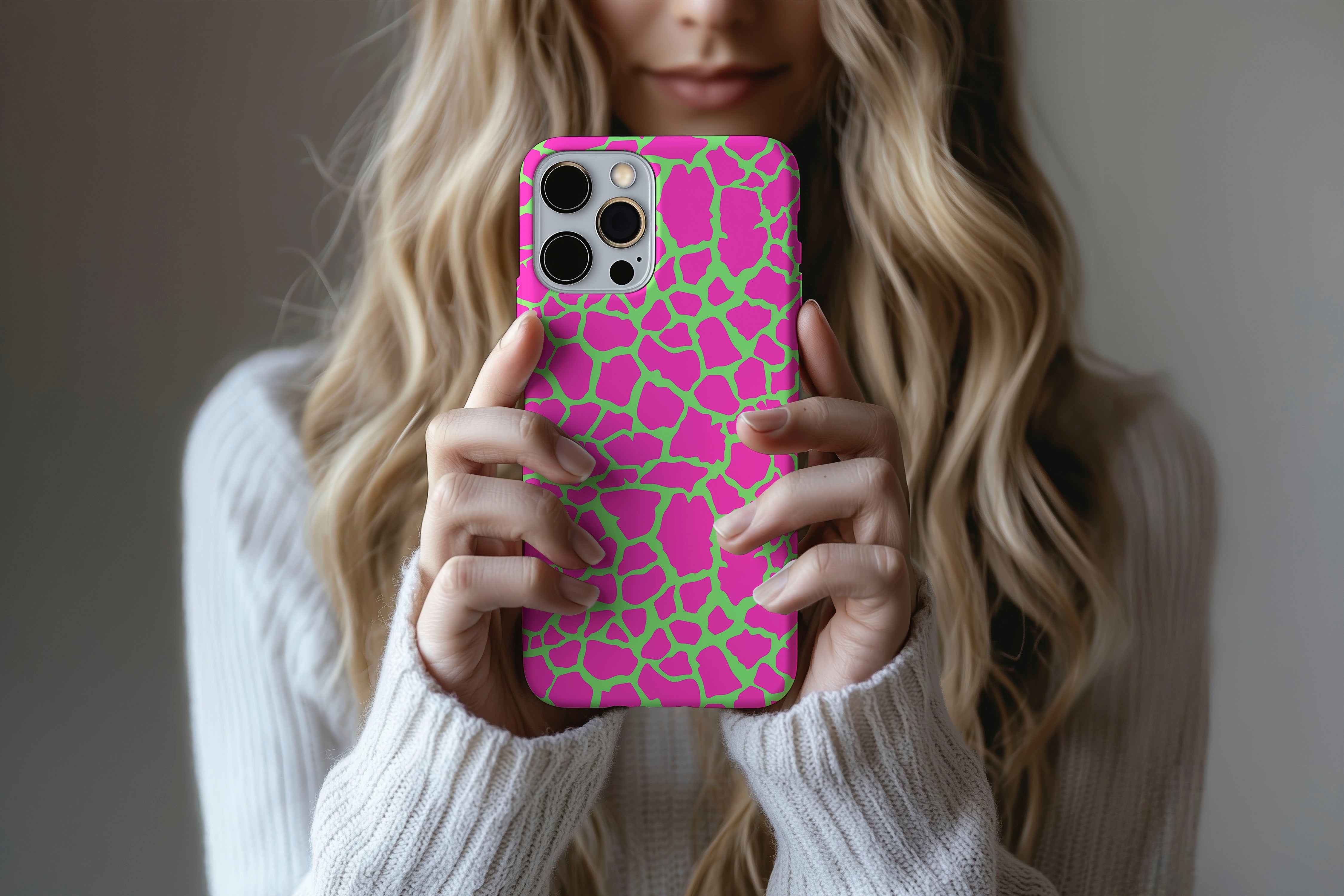 A cute girl holding a phone case featuring our Crackle Punk design