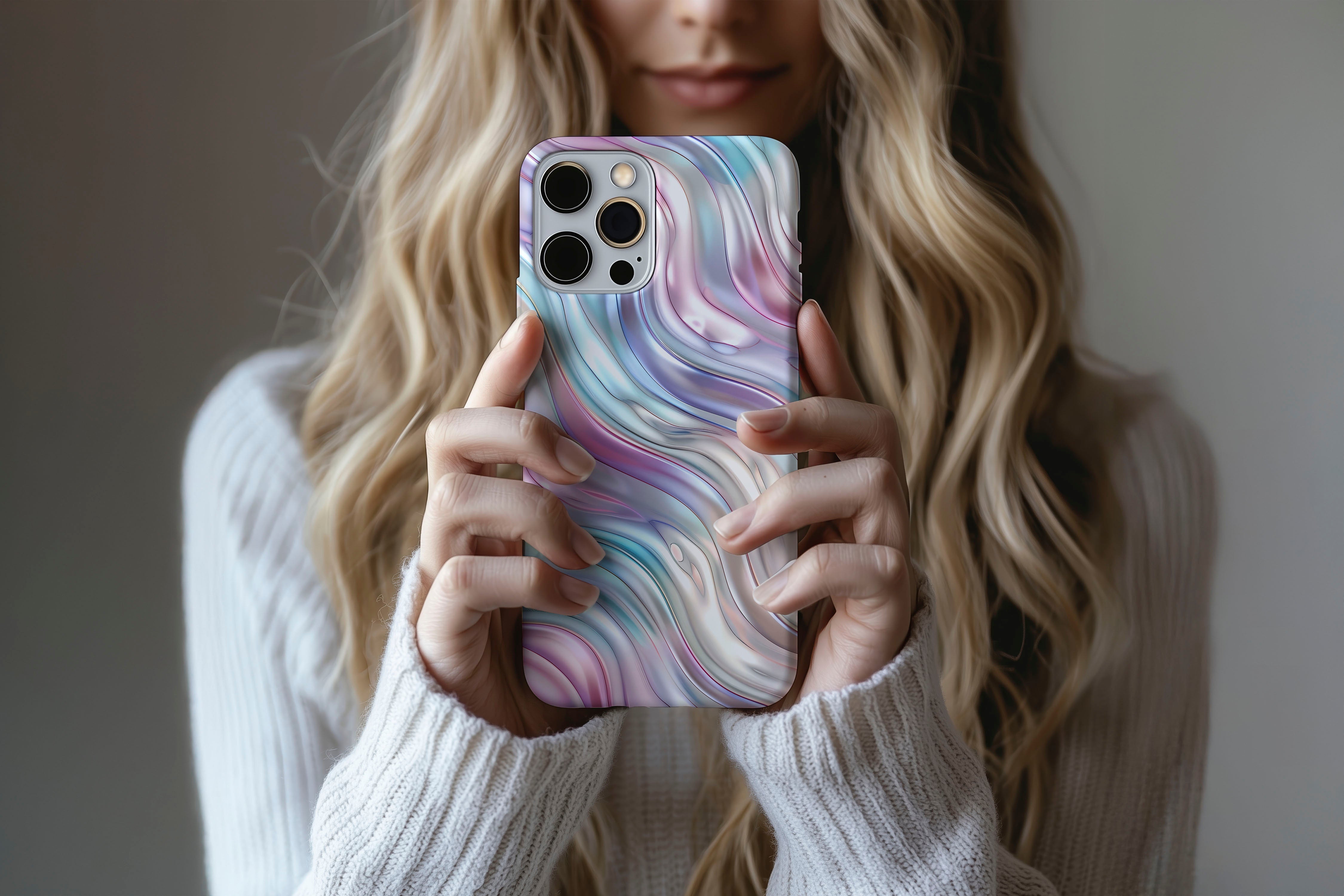 A cute girl holding a phone case featuring our Dreamy Weaver design