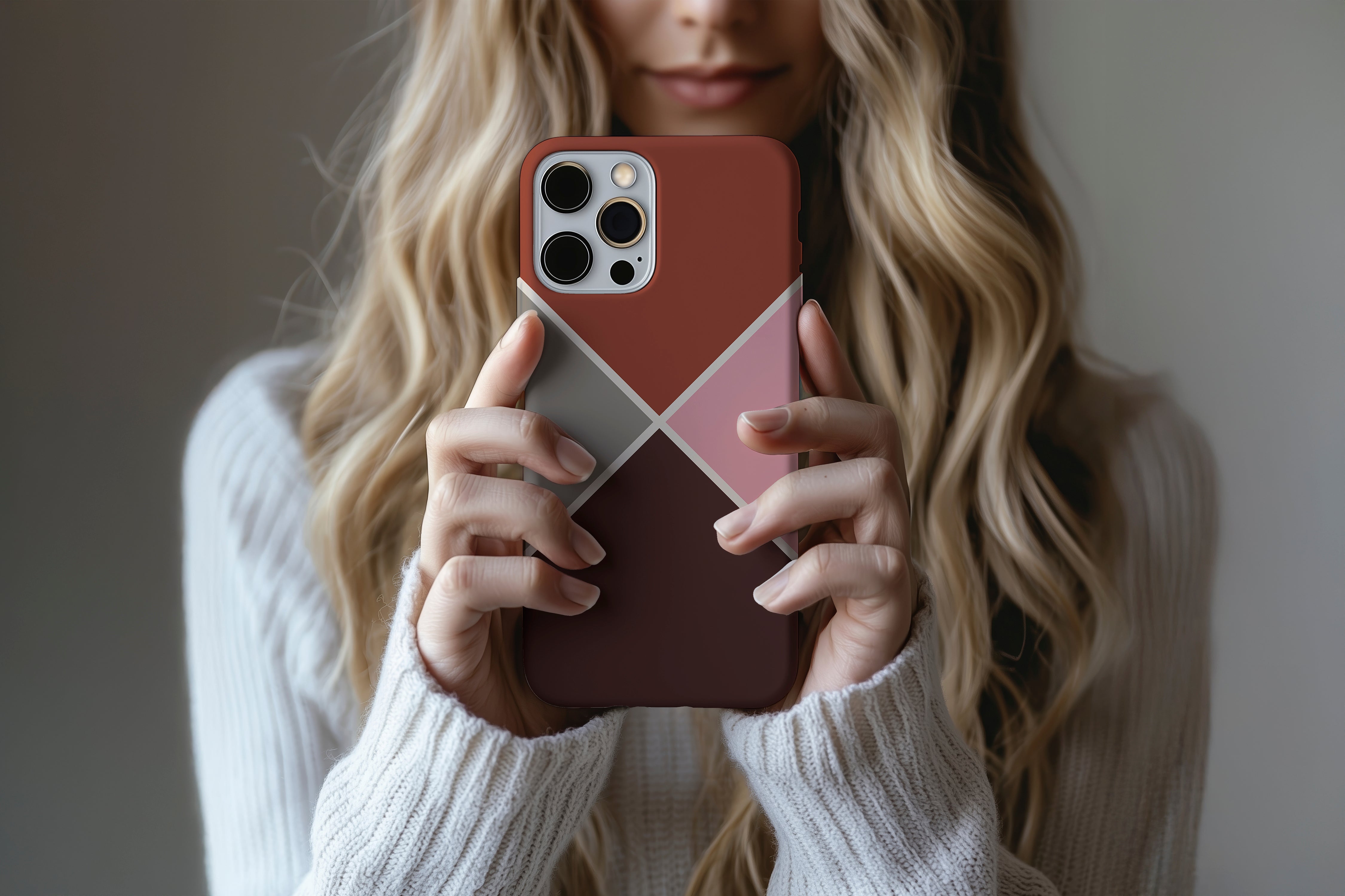 A cute girl holding a phone case featuring our Four Corners design