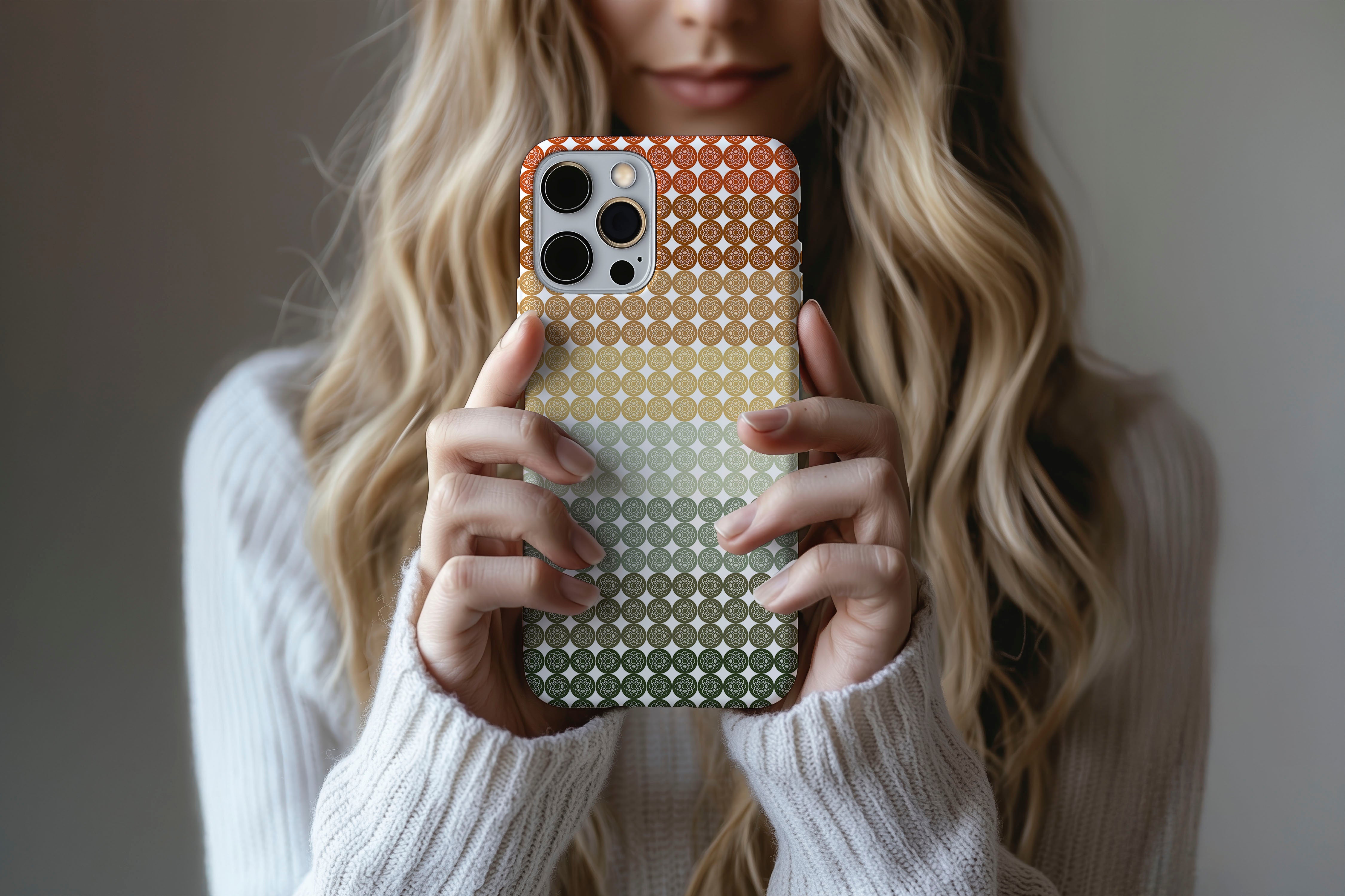 A cute girl holding a phone case featuring our Gradient Floral Stripe design