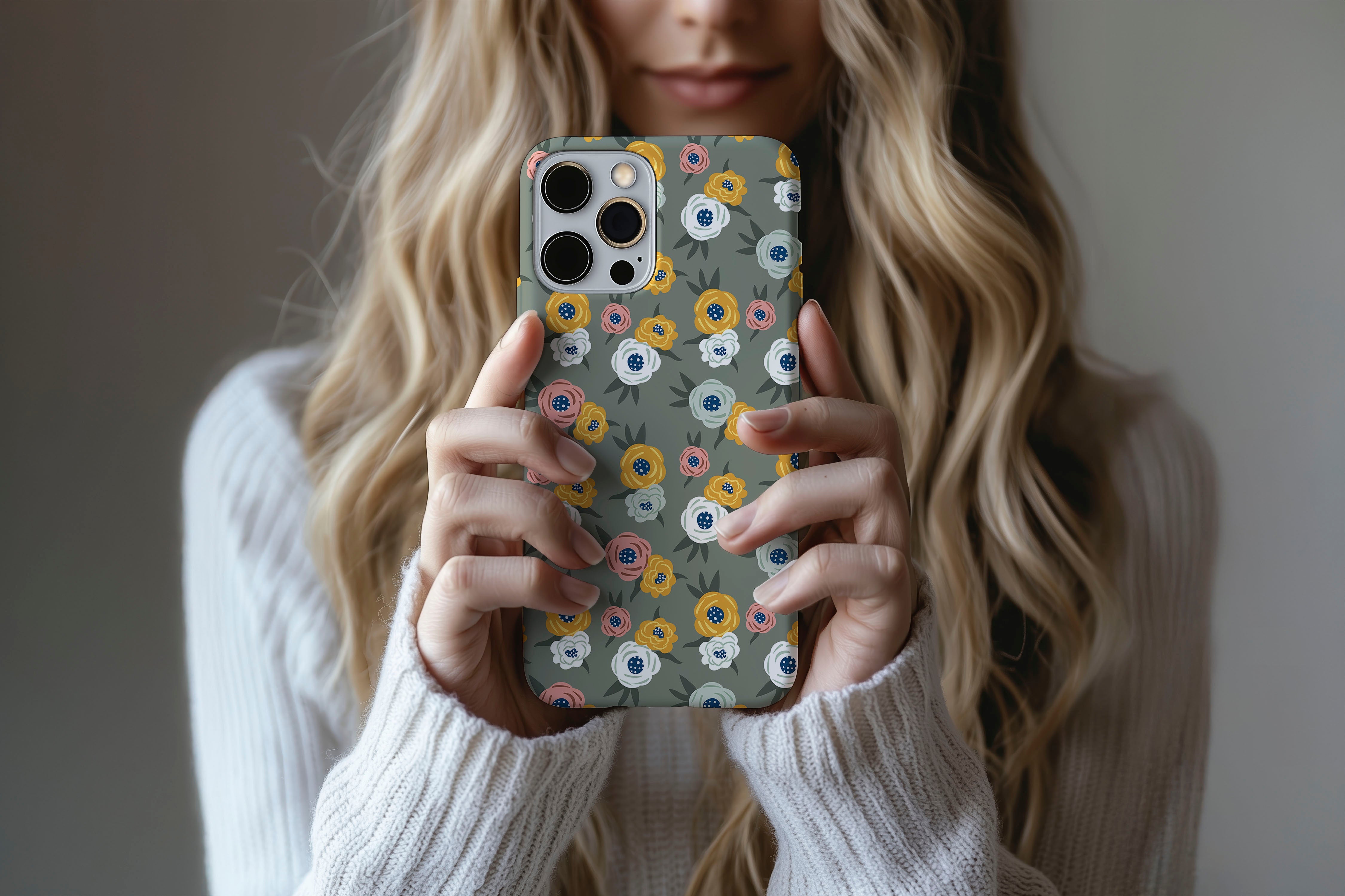 A cute girl holding a phone case featuring our Green Floral design