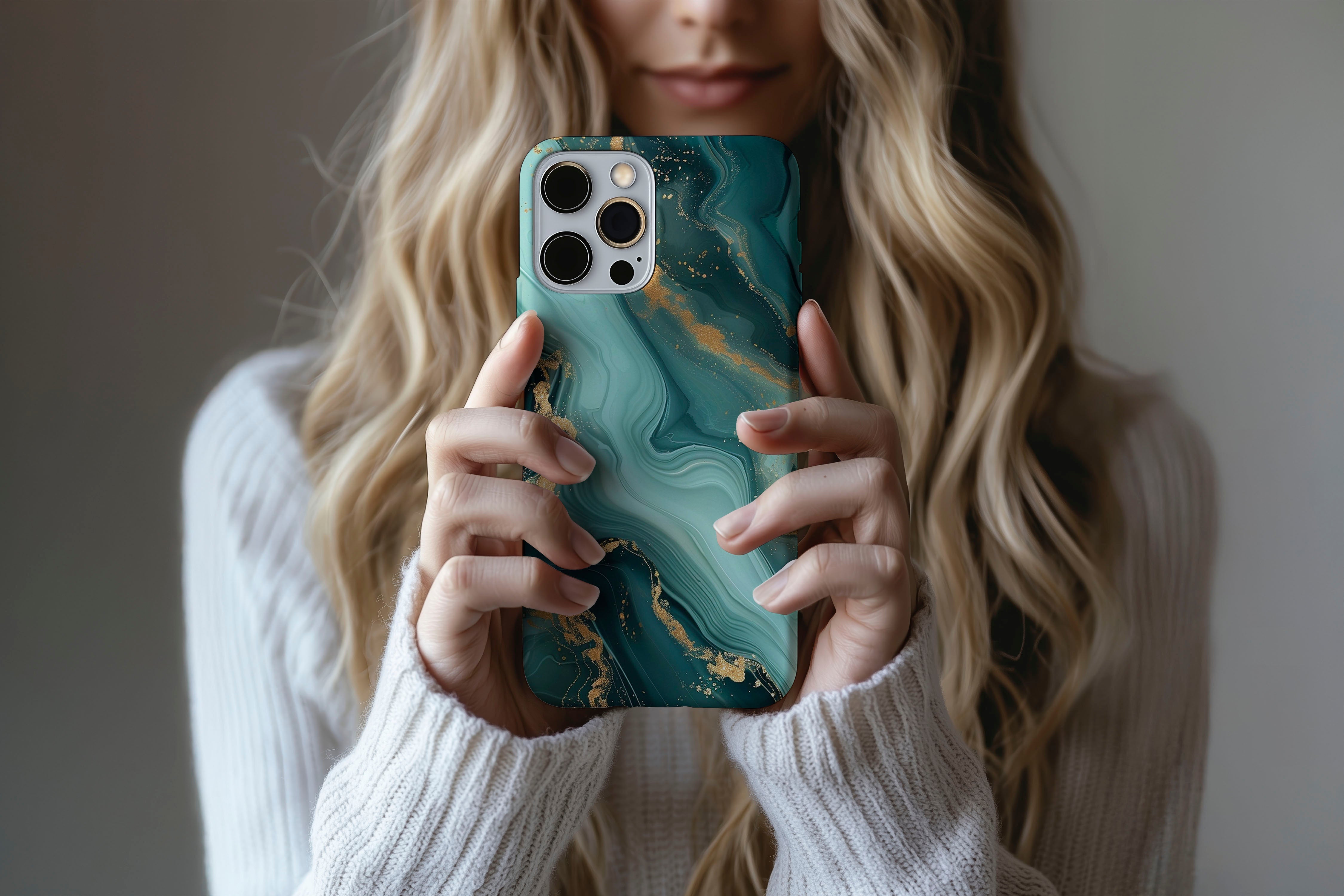 A cute girl holding a phone case featuring our Green Marble design