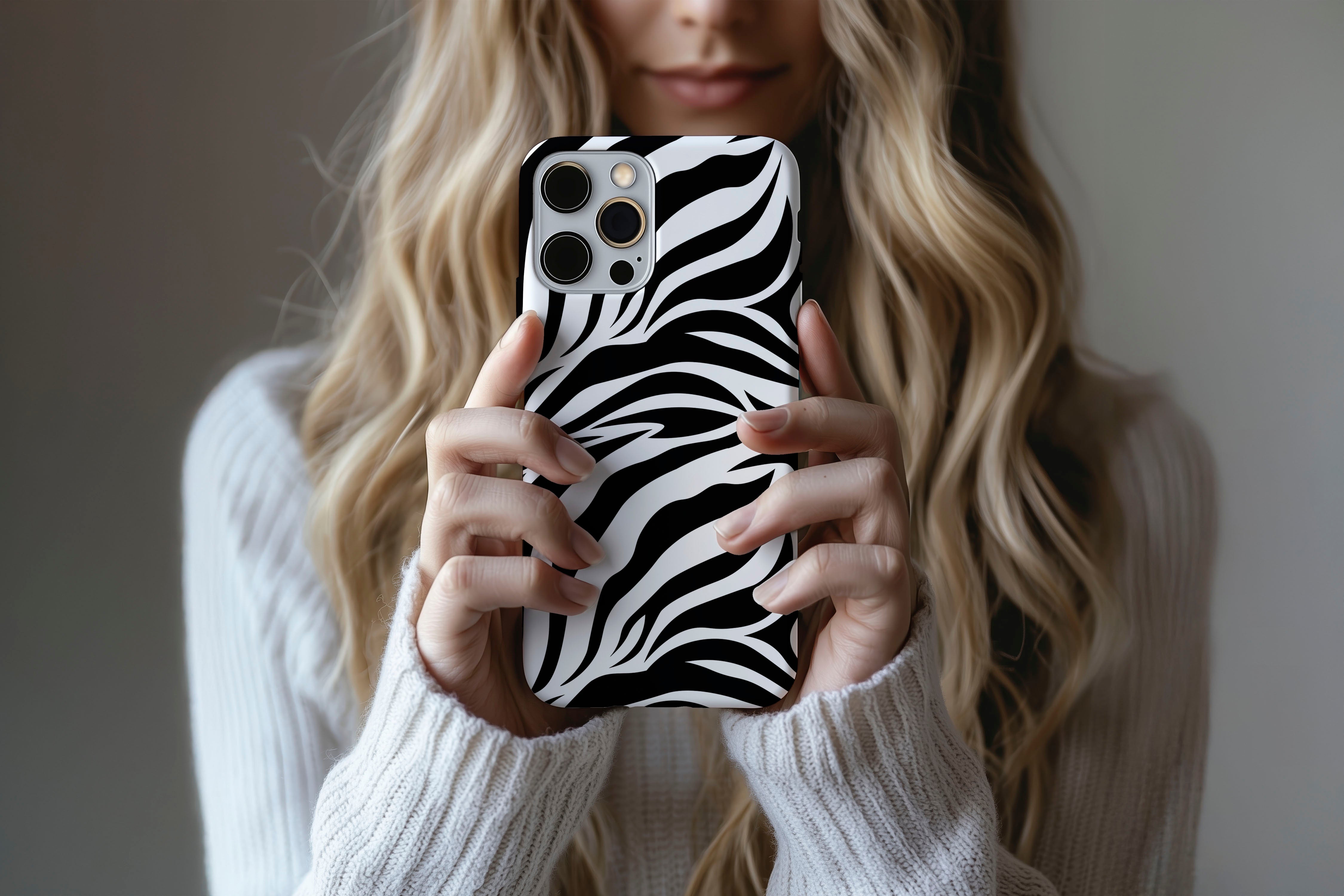 A cute girl holding a phone case featuring our Madagascar design