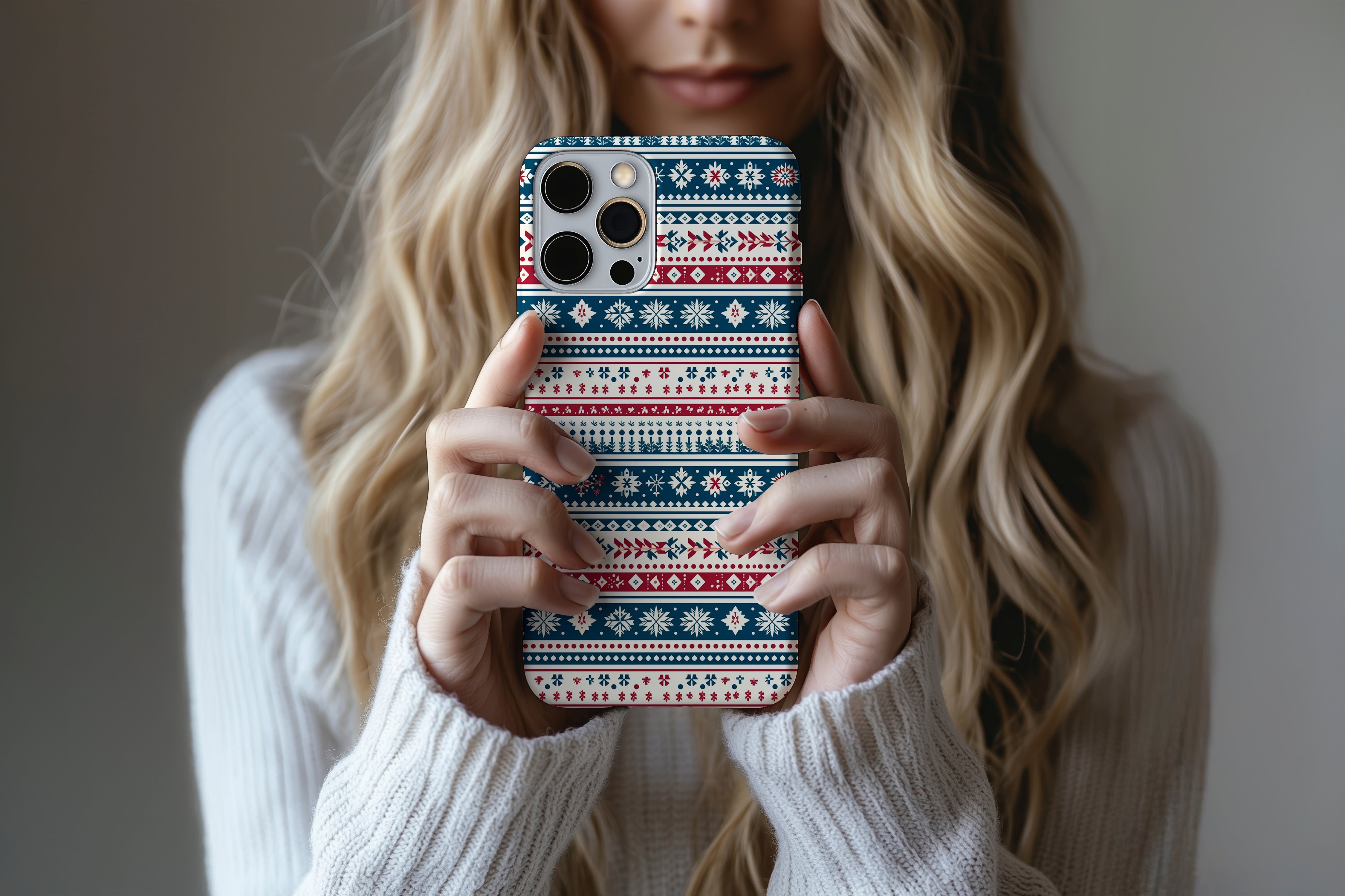 A cute girl holding a phone case featuring our Onesie design
