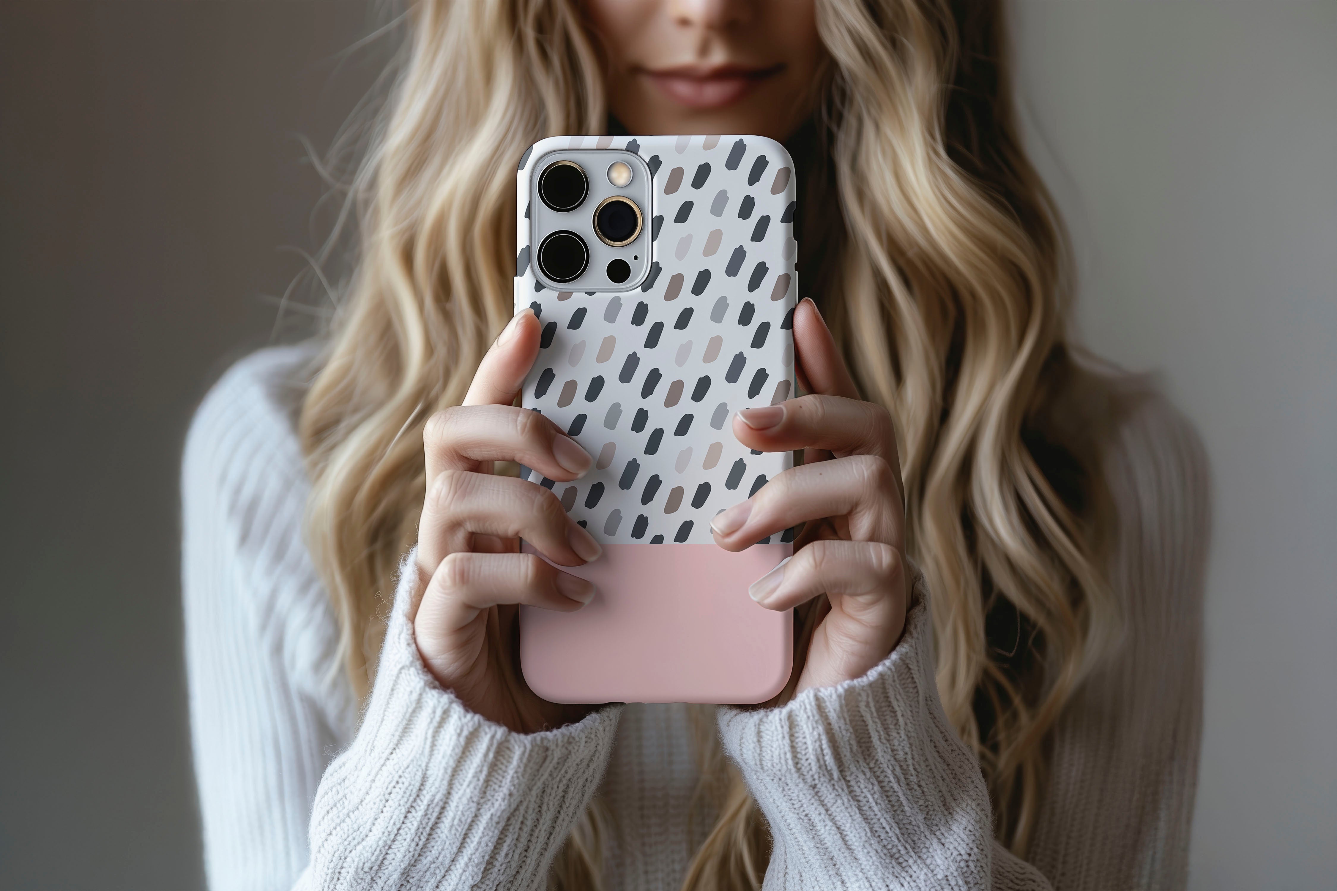 A cute girl holding a phone case featuring our Pink Mocca design