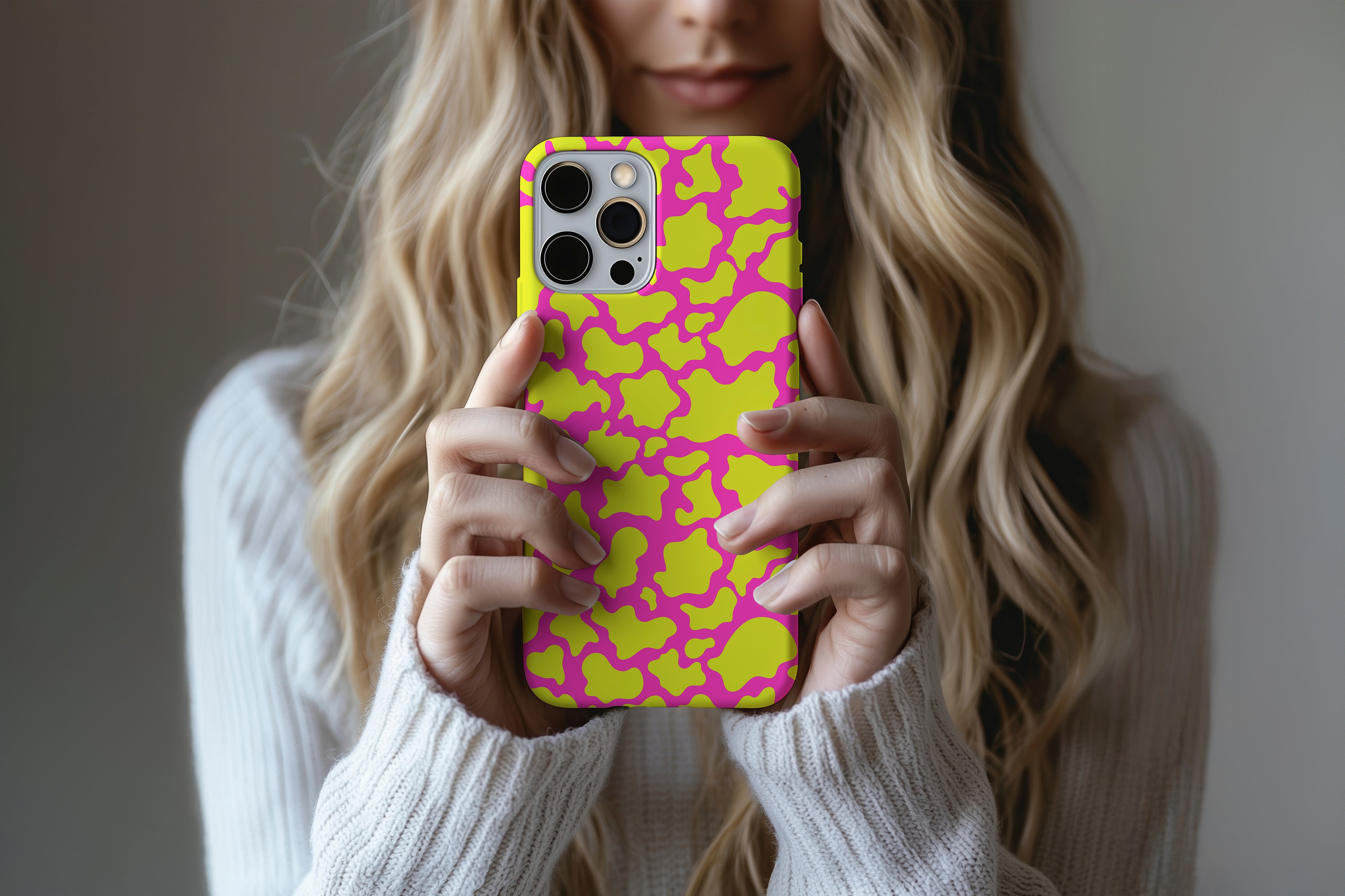 A cute girl holding a phone case featuring our Pink Punk design