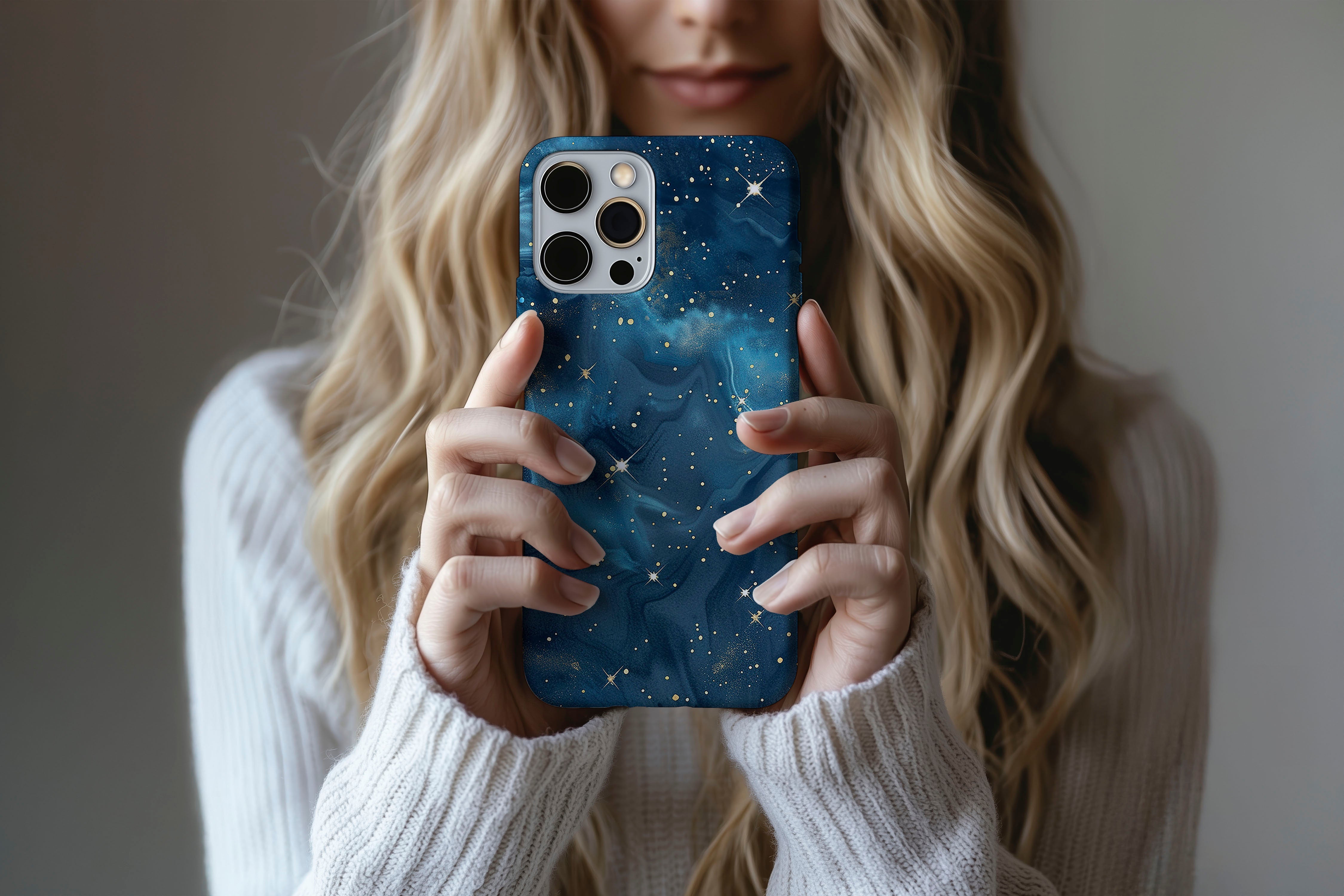 A cute girl holding a phone case featuring our Starry Night design