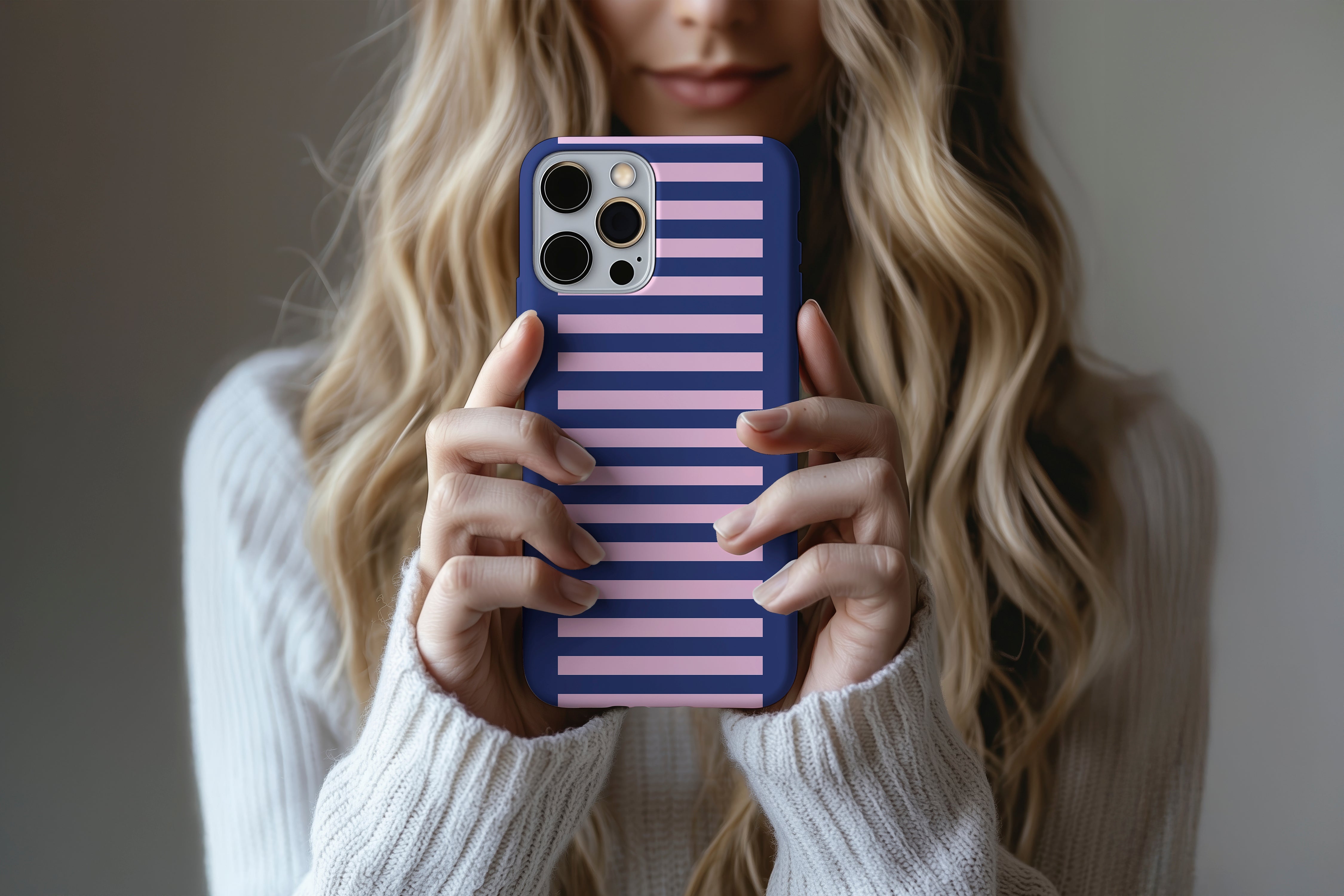 A cute girl holding a phone case featuring our Vibes design