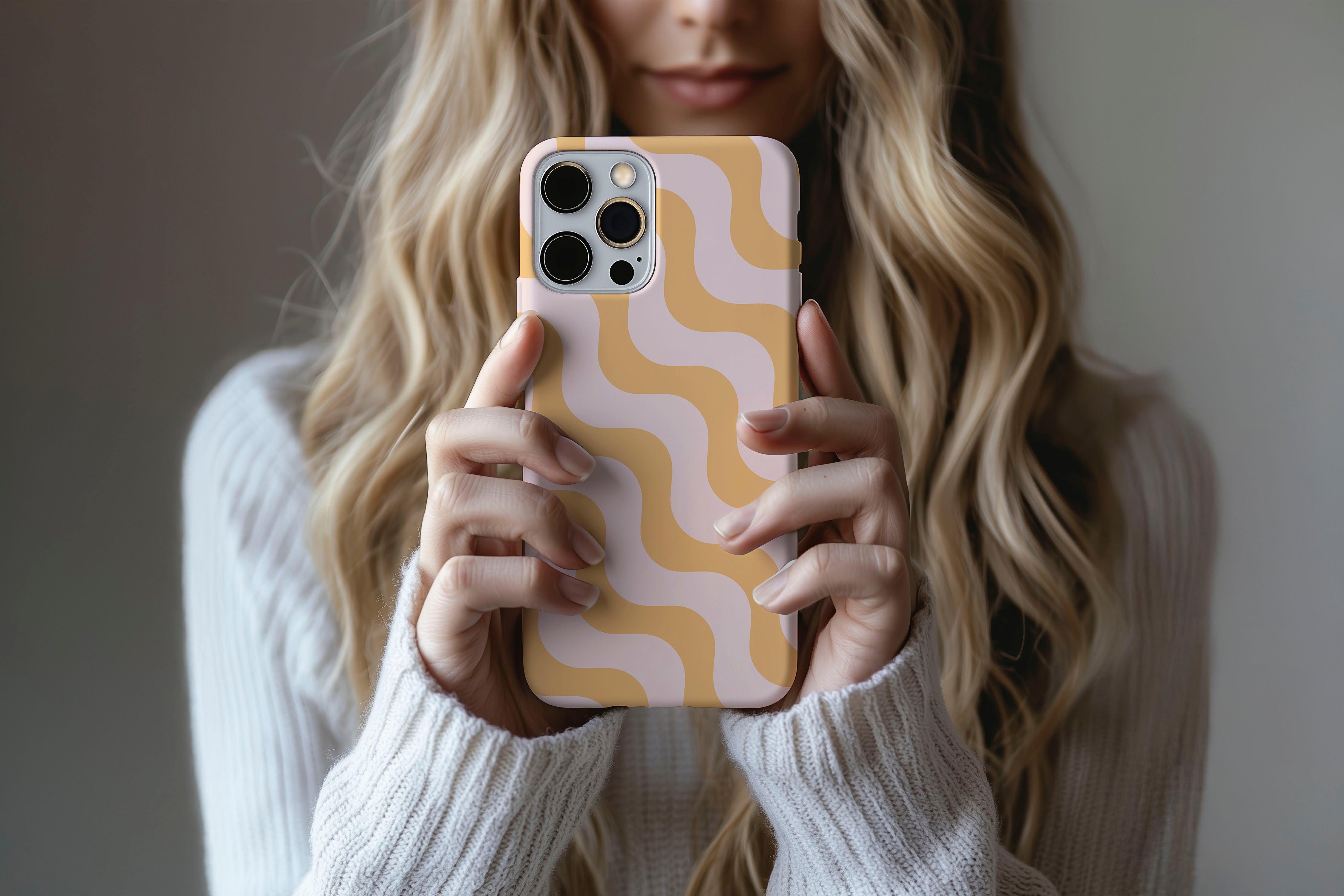 A cute girl holding a phone case featuring our Wiggle Wiggle design