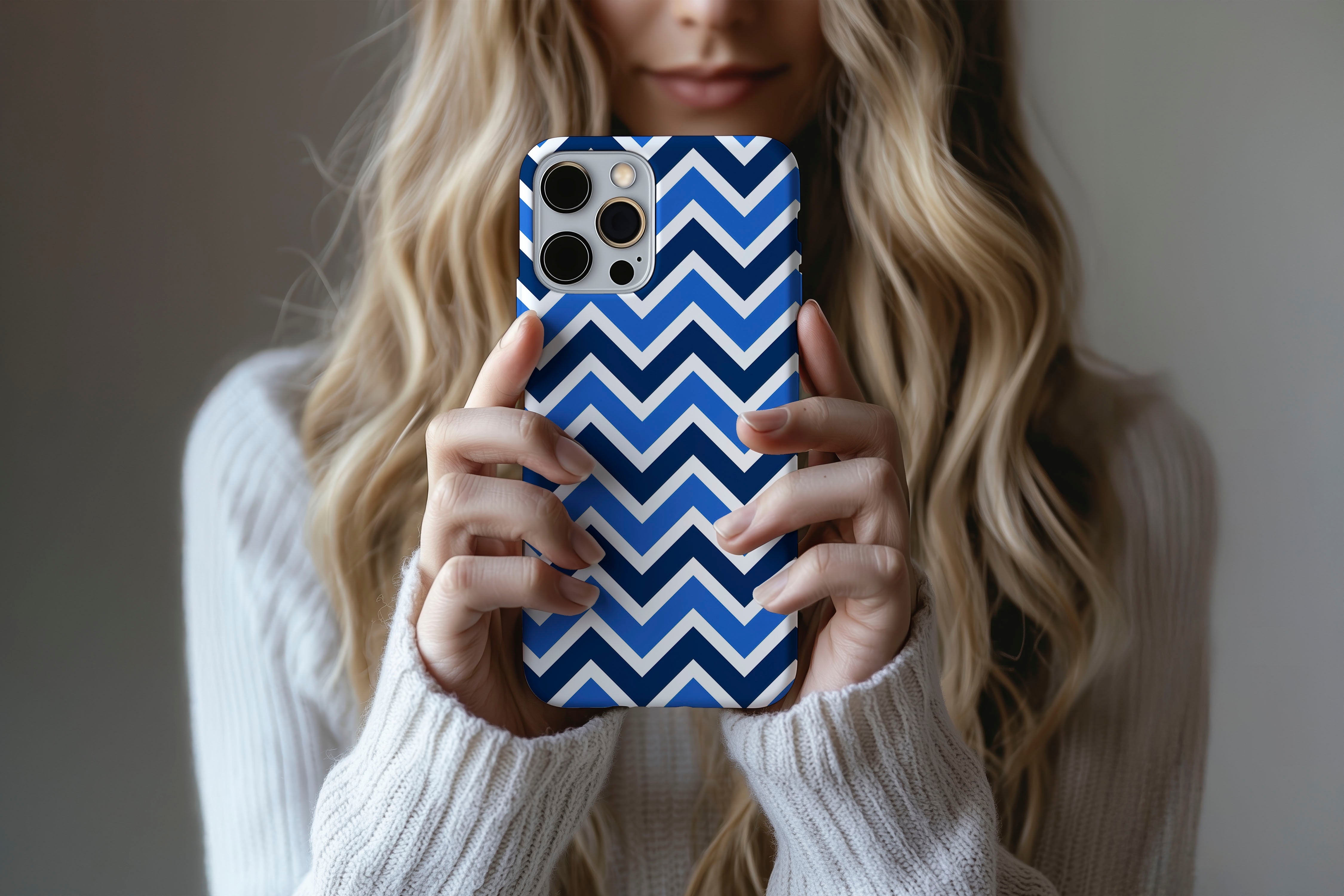 A cute girl holding a phone case featuring our Zig design