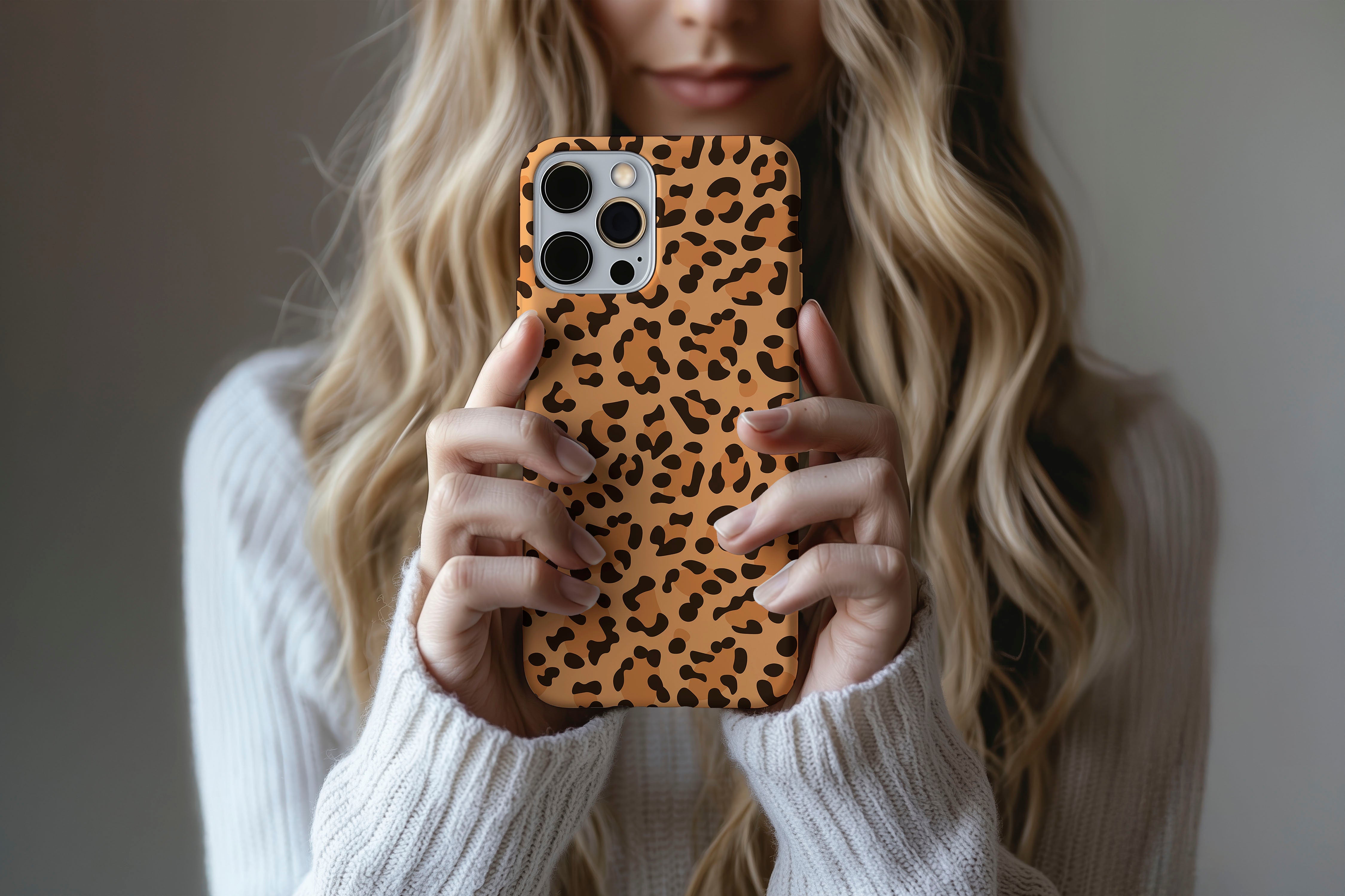 A cute girl holding a phone case featuring our Big Cat design