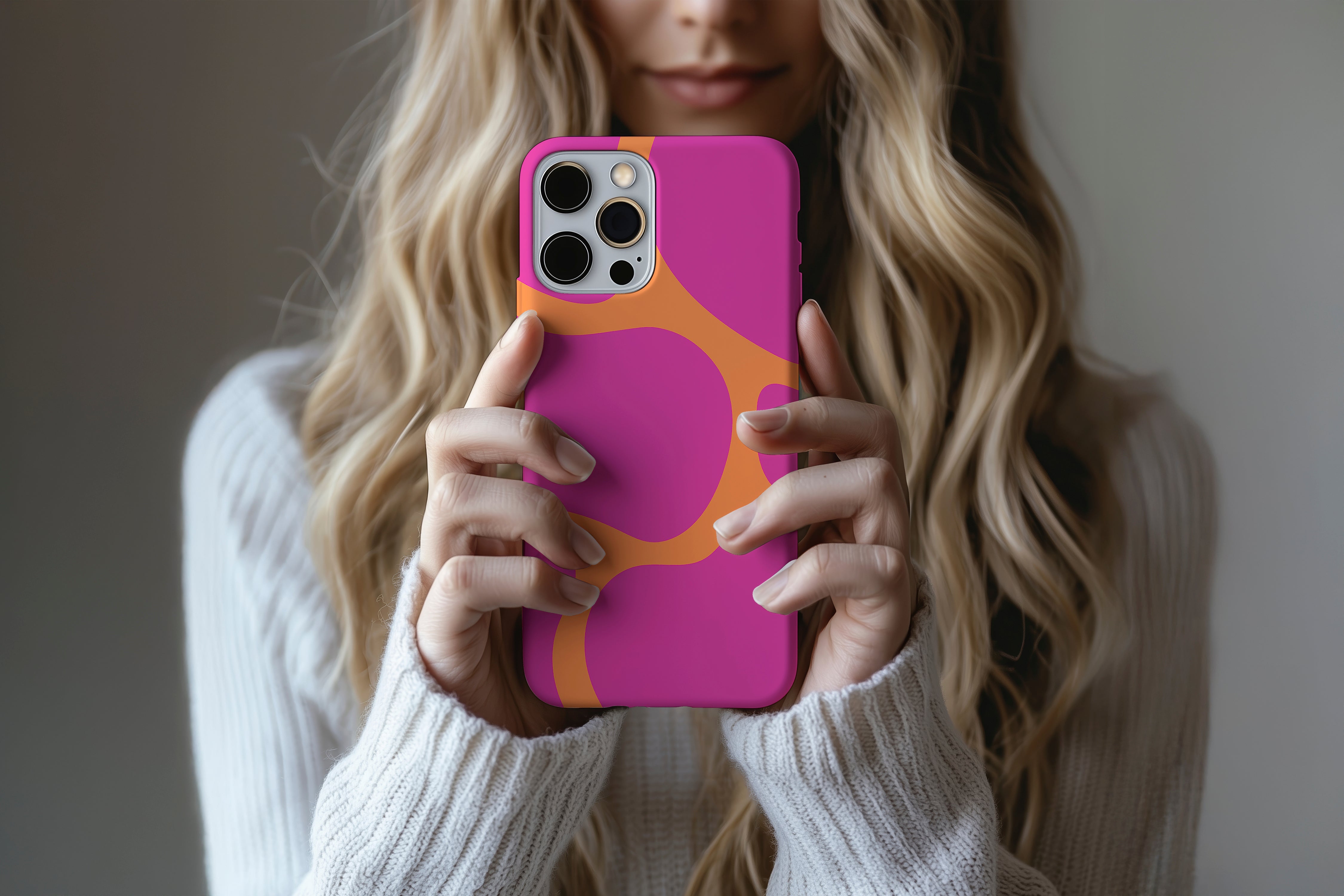 A cute girl holding a phone case featuring our Clashing  design