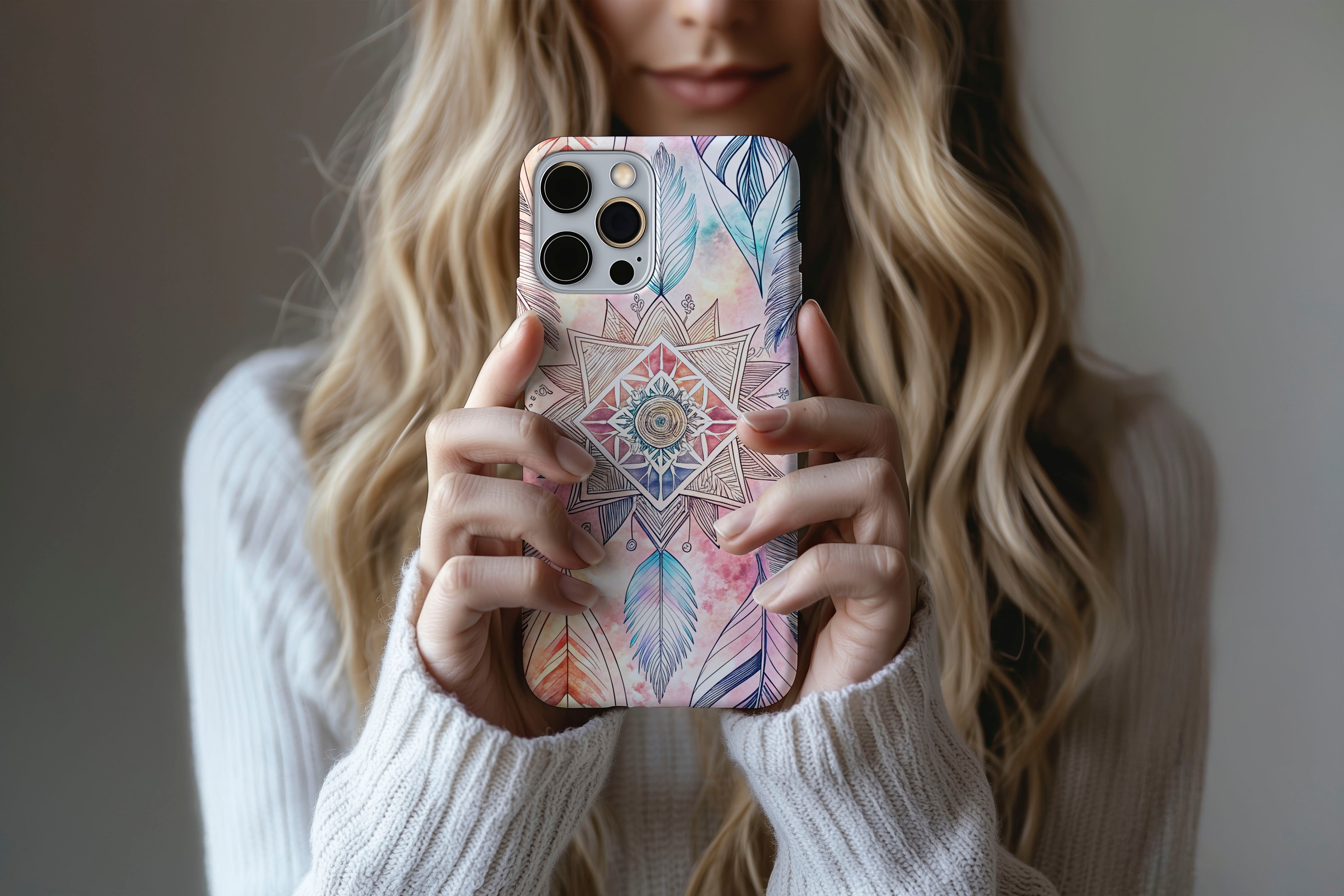 A cute girl holding a phone case featuring our Dream Catcher design