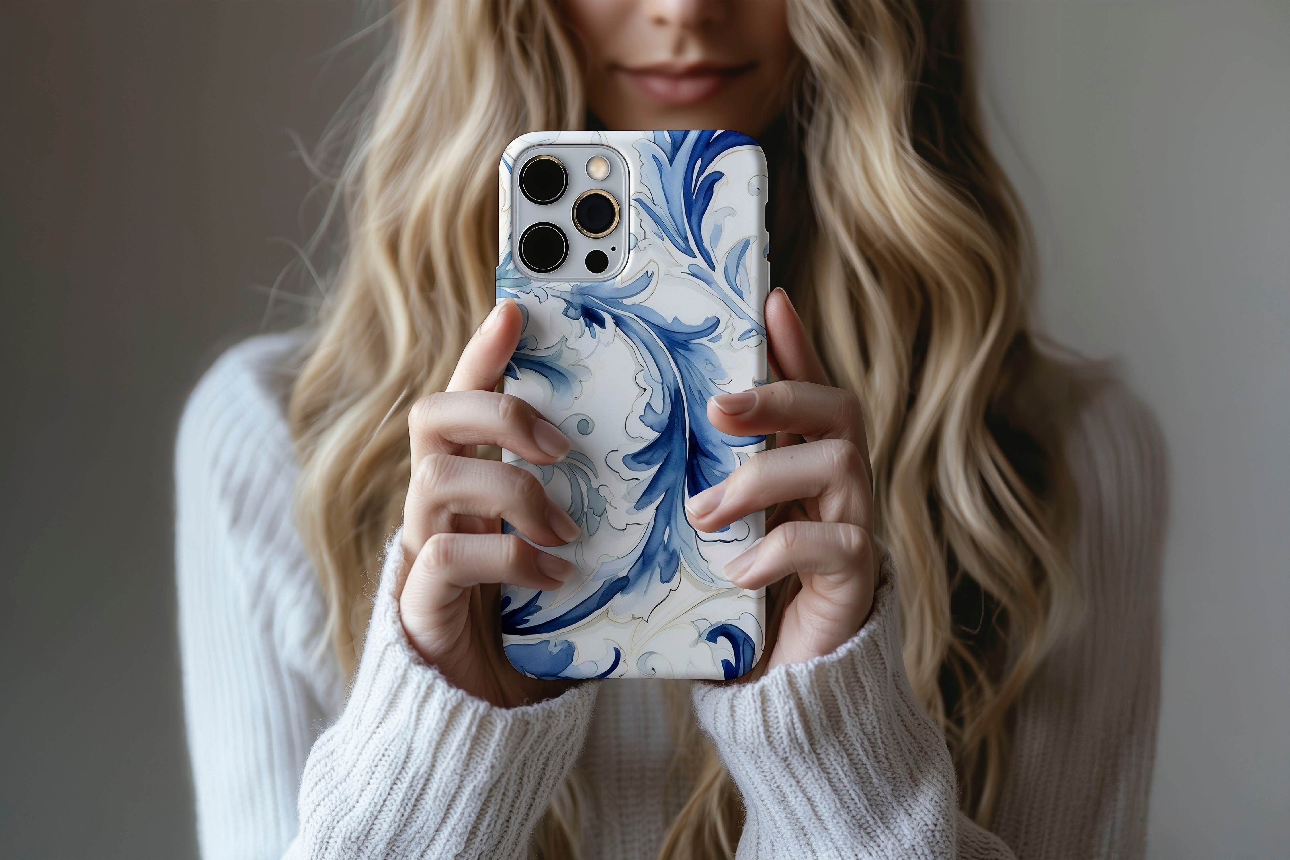 A cute girl holding a phone case featuring our Dreamy design