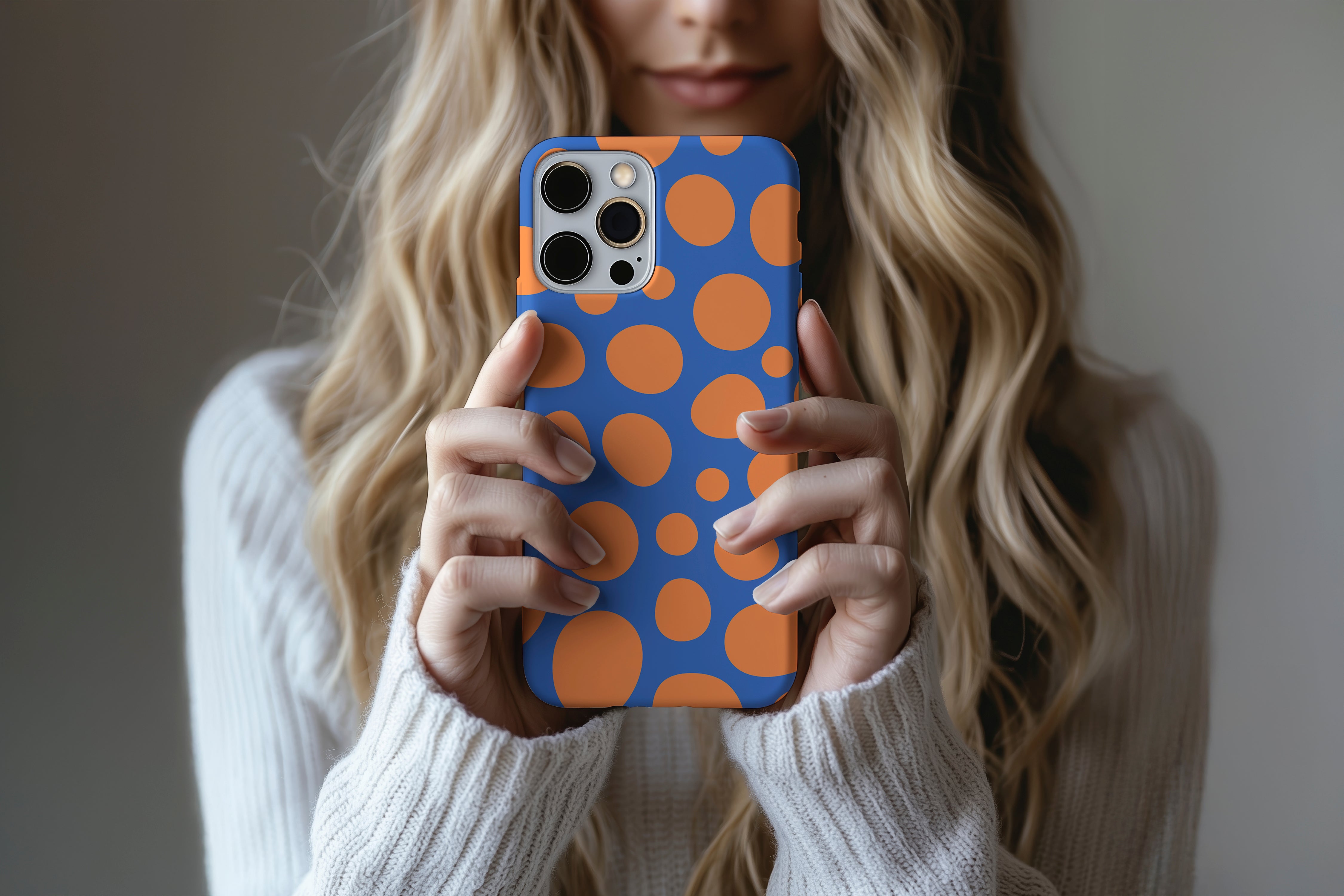 A cute girl holding a phone case featuring our Fizzy Bubble  design