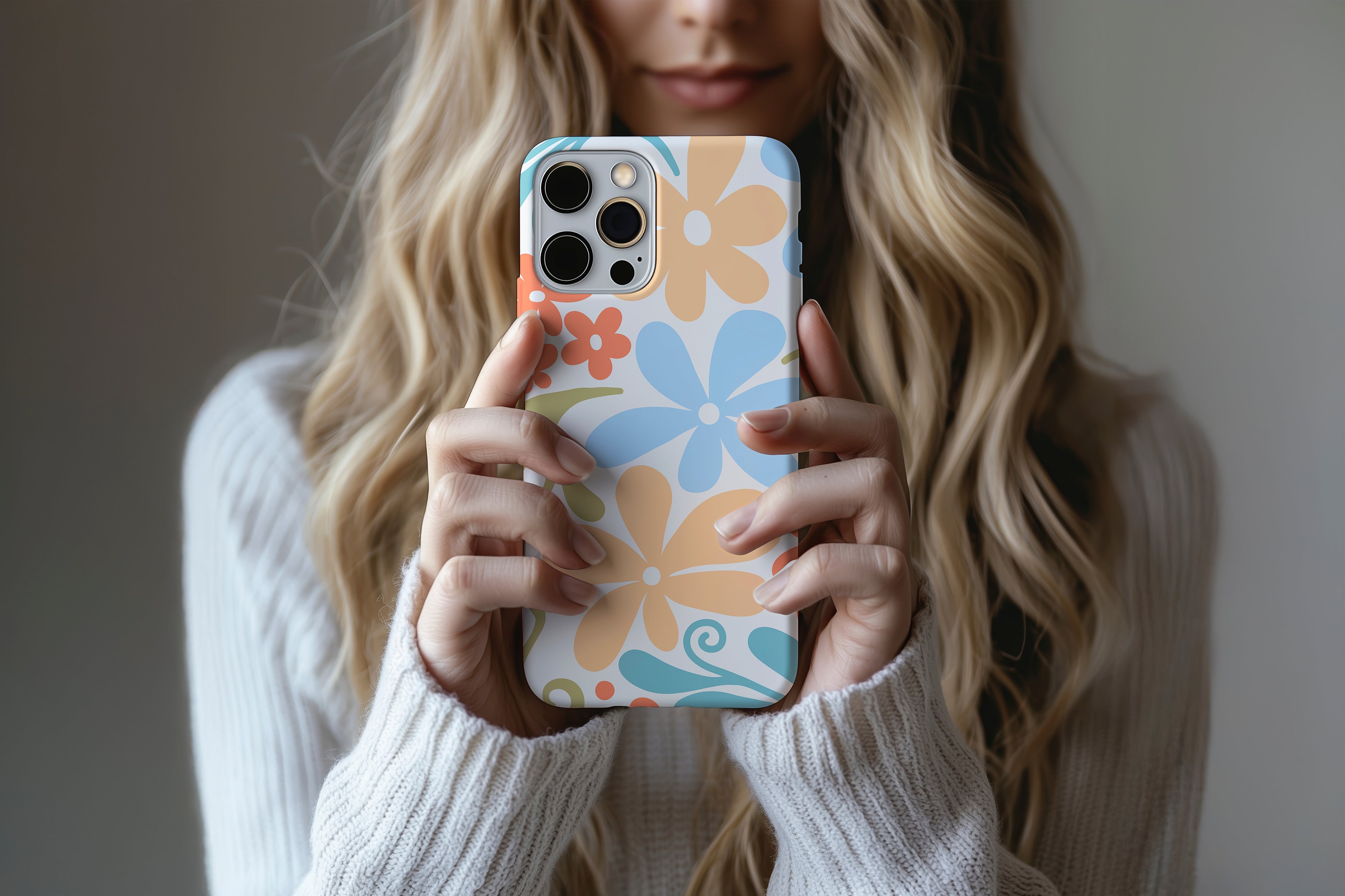A cute girl holding a phone case featuring our Flower Power  design