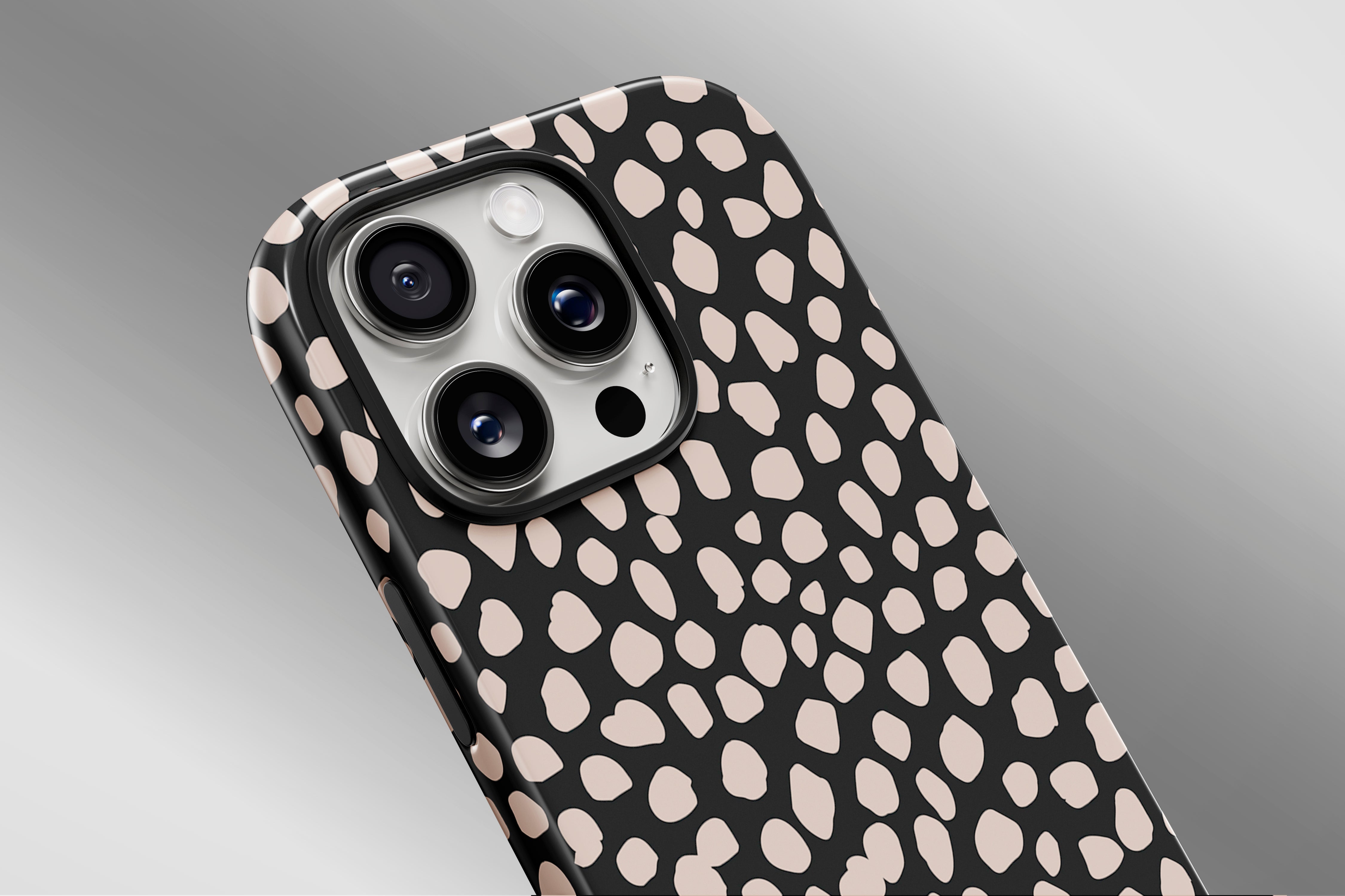 A close up image of a phone case featuring our Pebbles  design