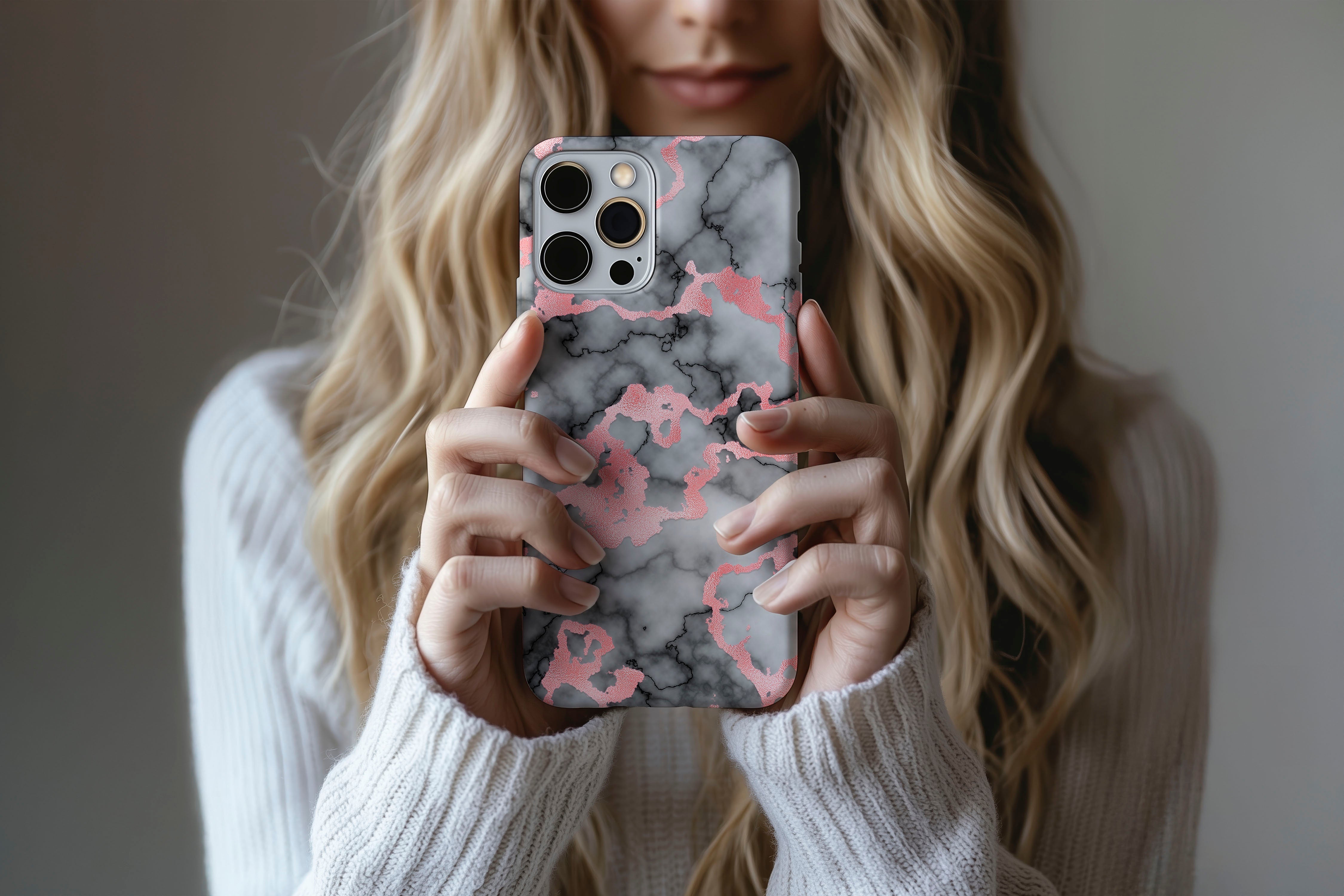 A cute girl holding a phone case featuring our Rose Marble design