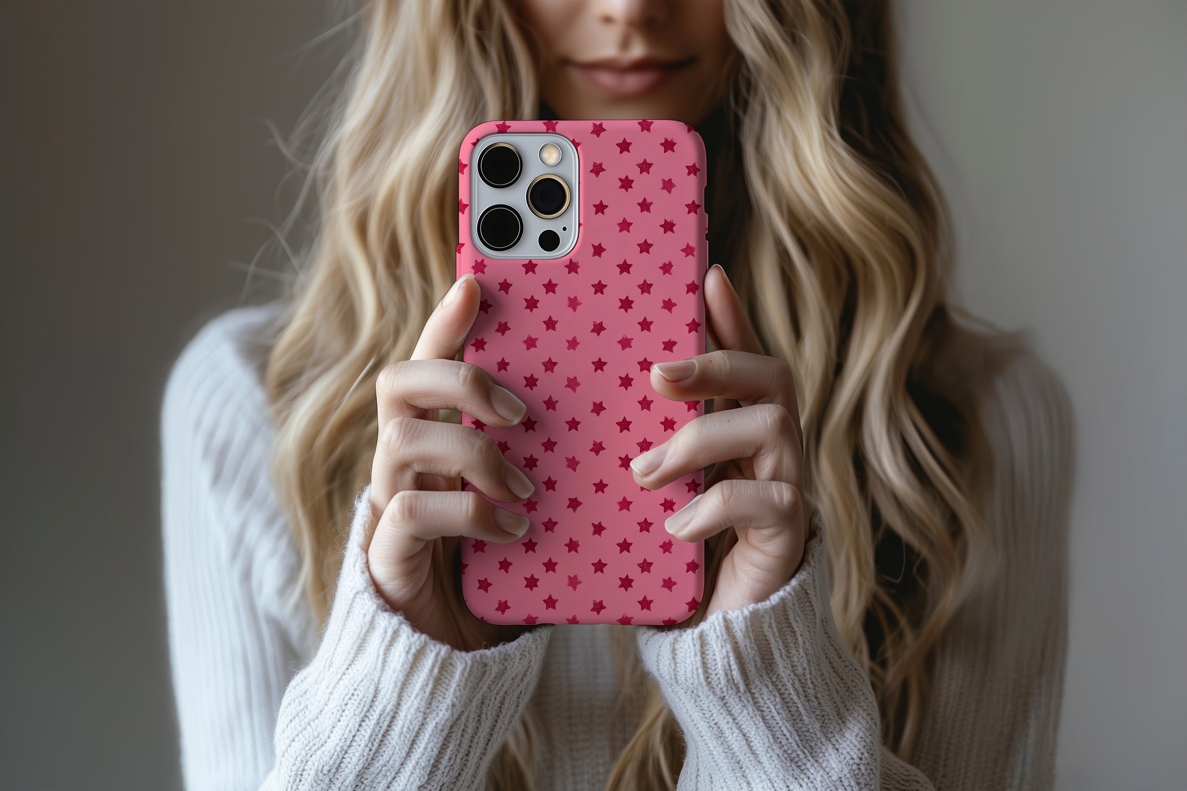 A cute girl holding a phone case featuring our Rouge Stars  design