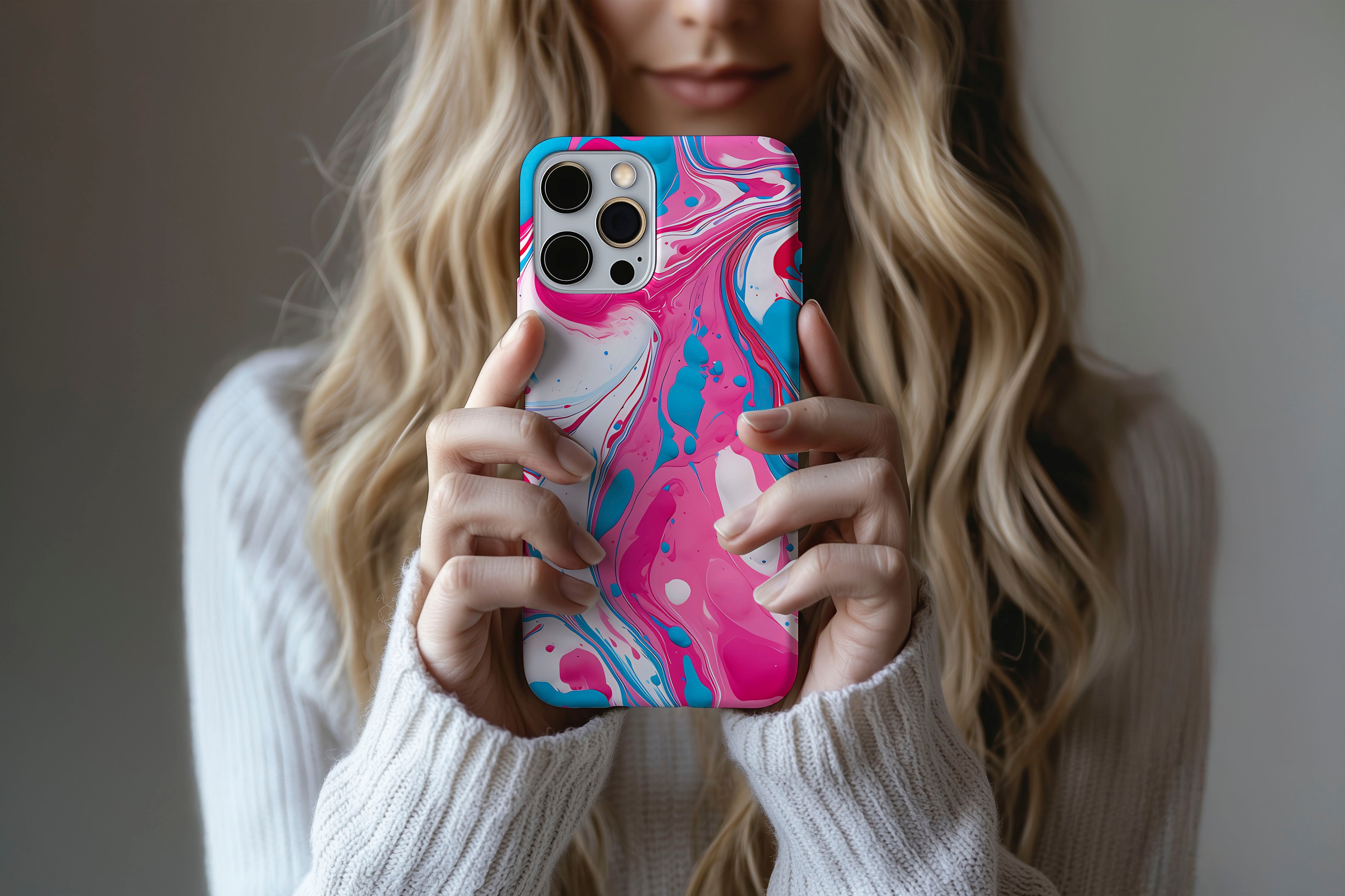 A cute girl holding a phone case featuring our Splash Down design