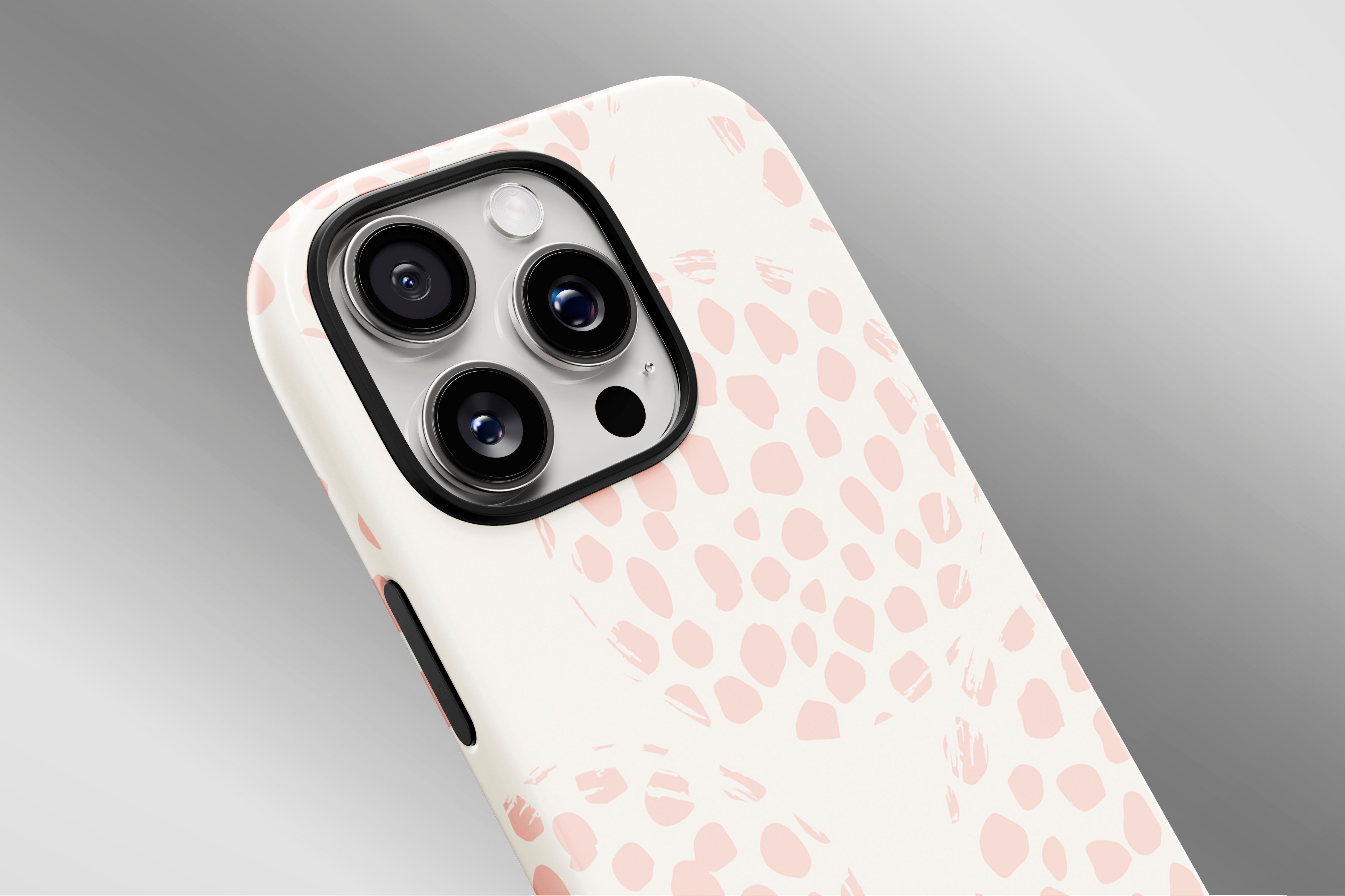 A close up image of a phone case featuring our Spotty Pink  design