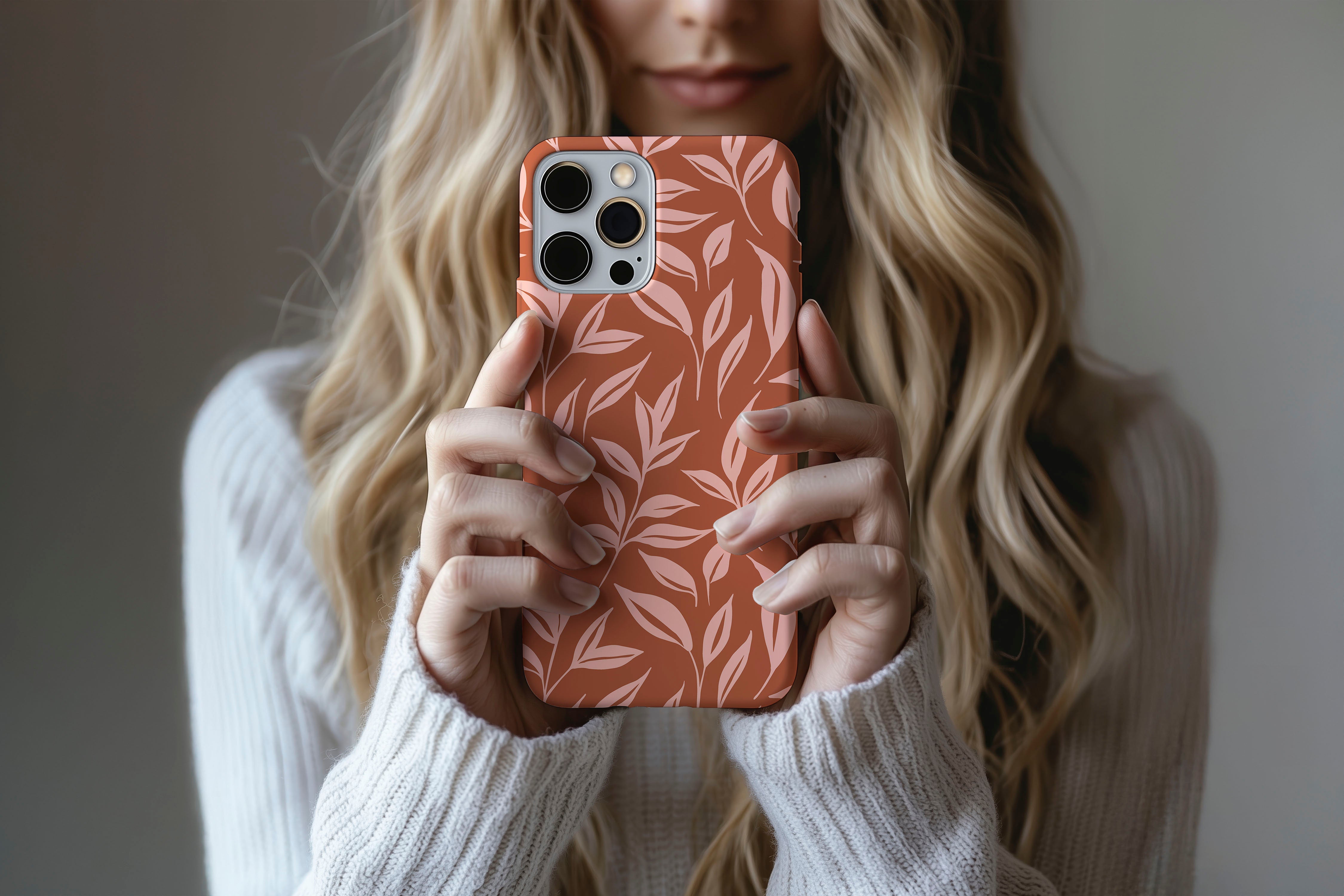 A cute girl holding a phone case featuring our Toffee design